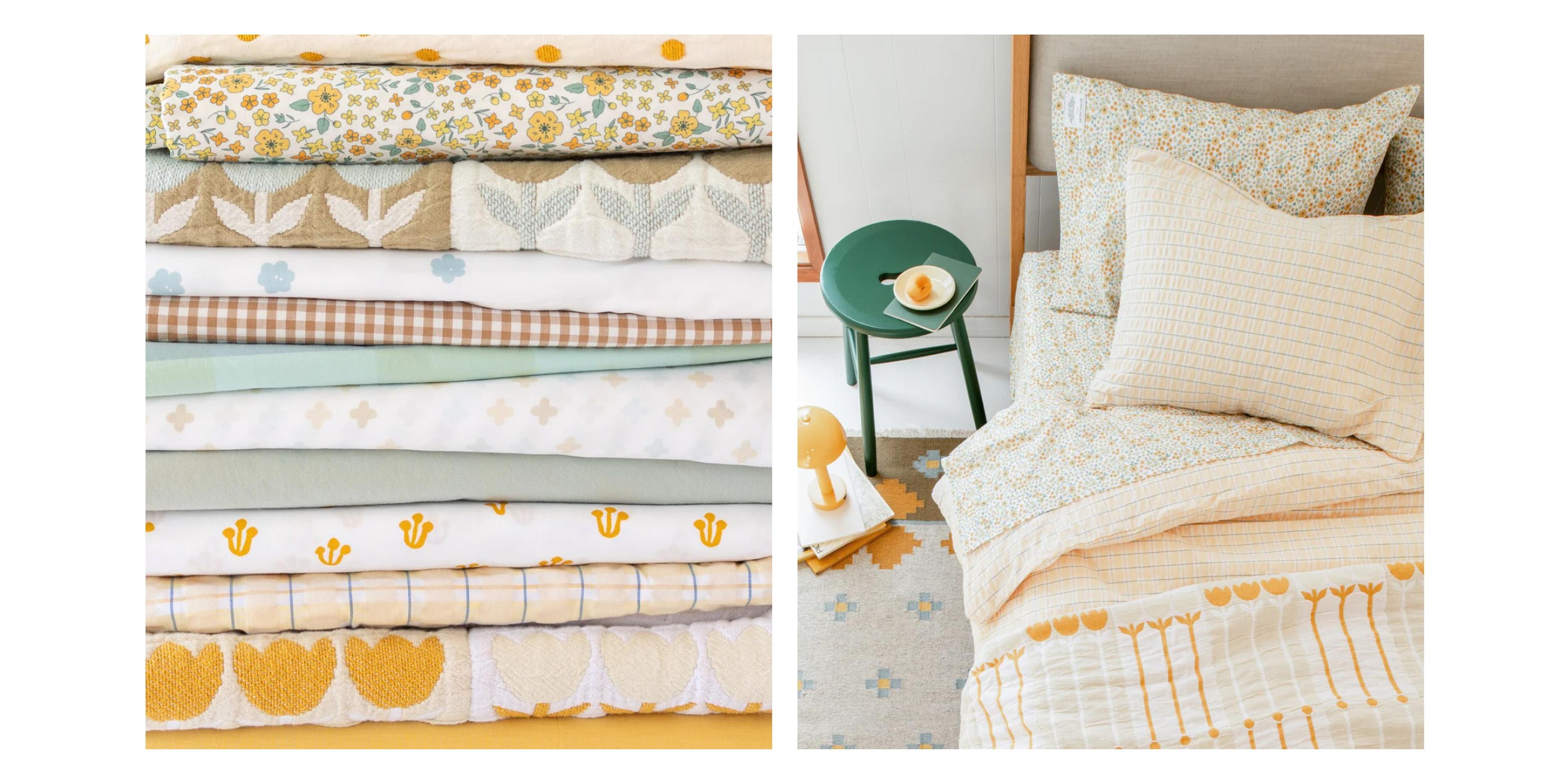 Bedding stack featuring lots of colorful, spring bedding. 