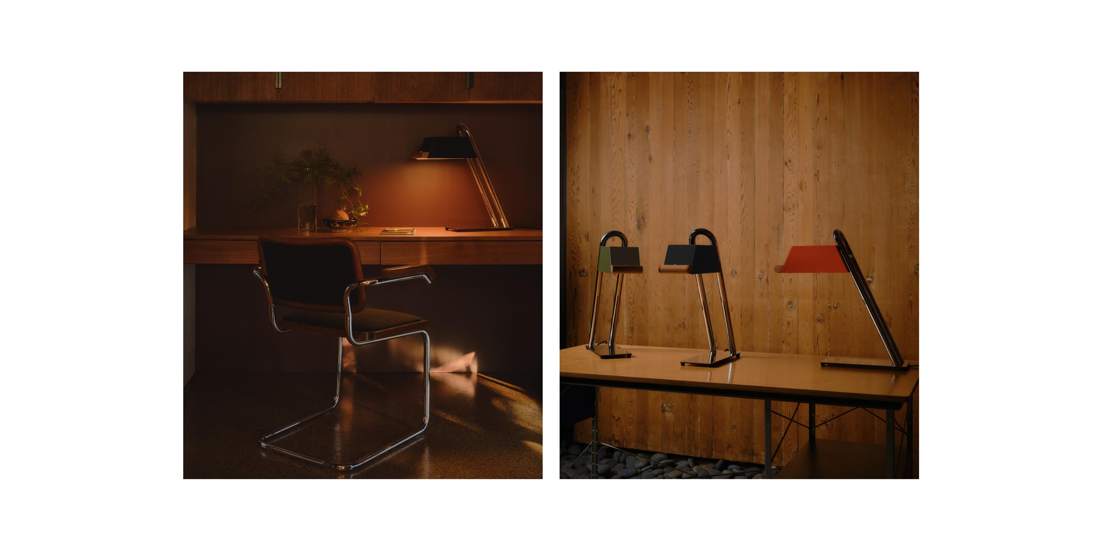 Dim-lit work station with wooden desk and mid century designed chair with metal and chrome table lamp lit