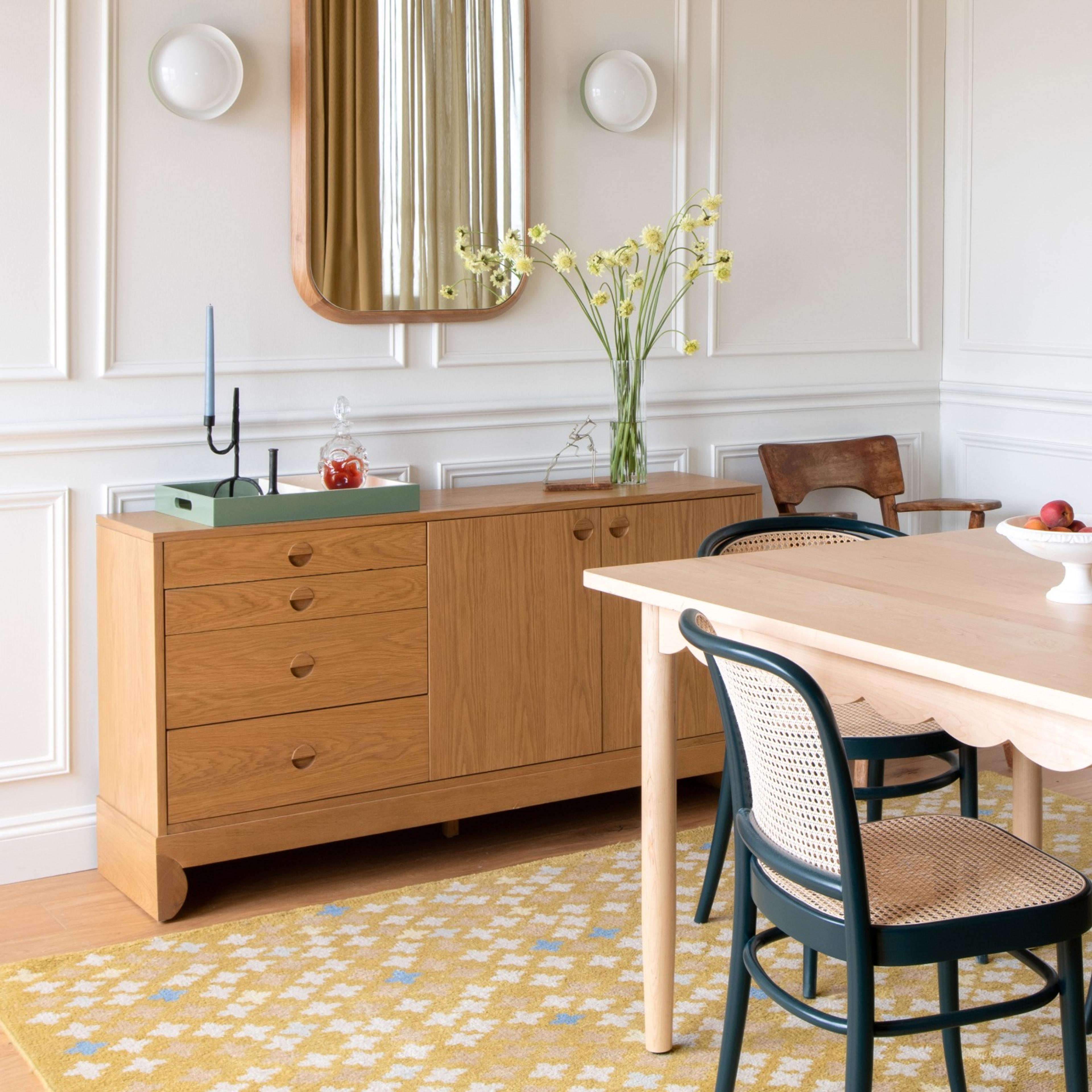 Bright dining room with June table, sundrop rug, and side board