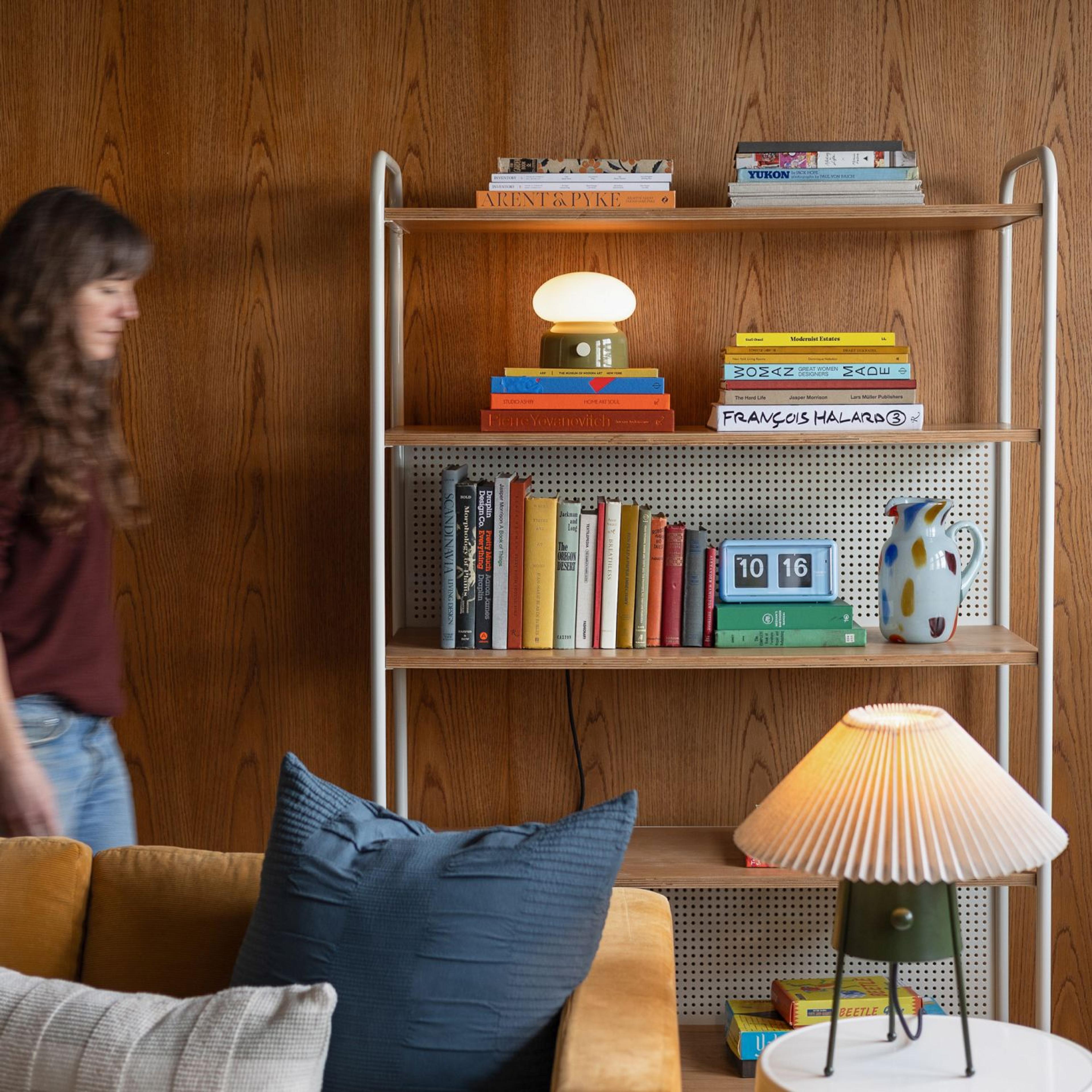 woman walking through a living room