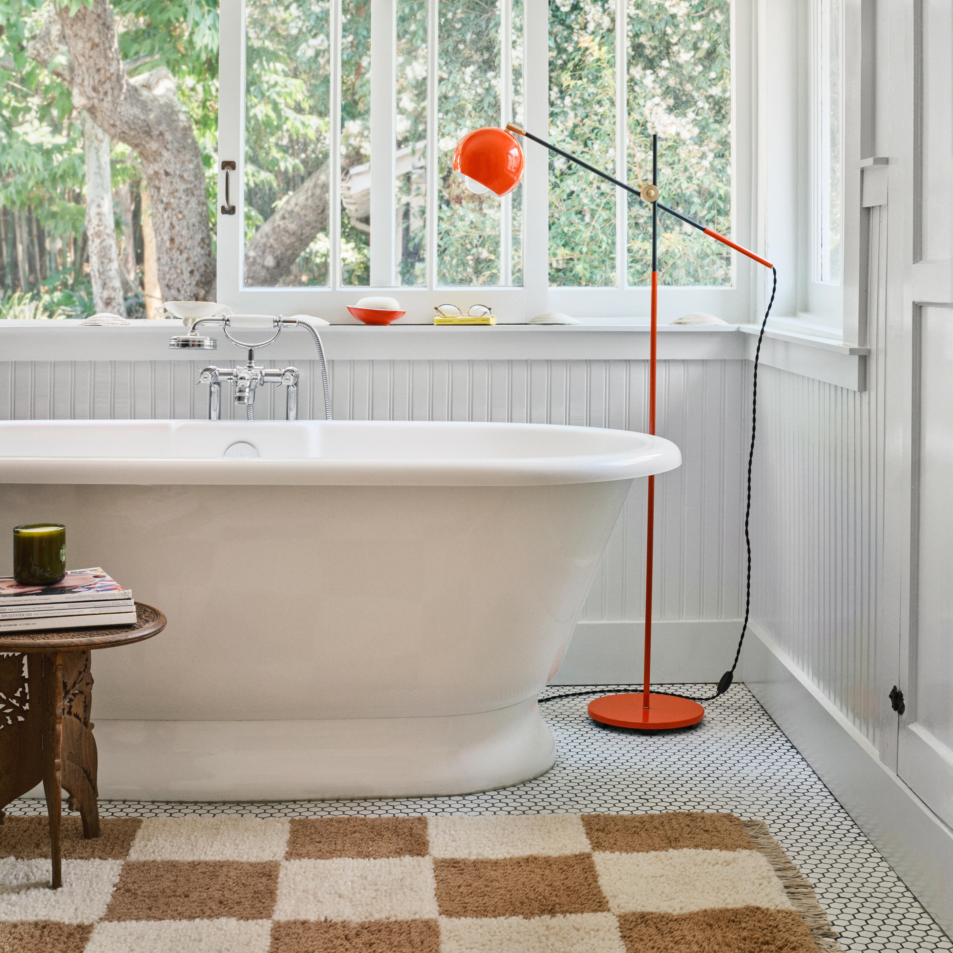 Lamp by bathtub. 