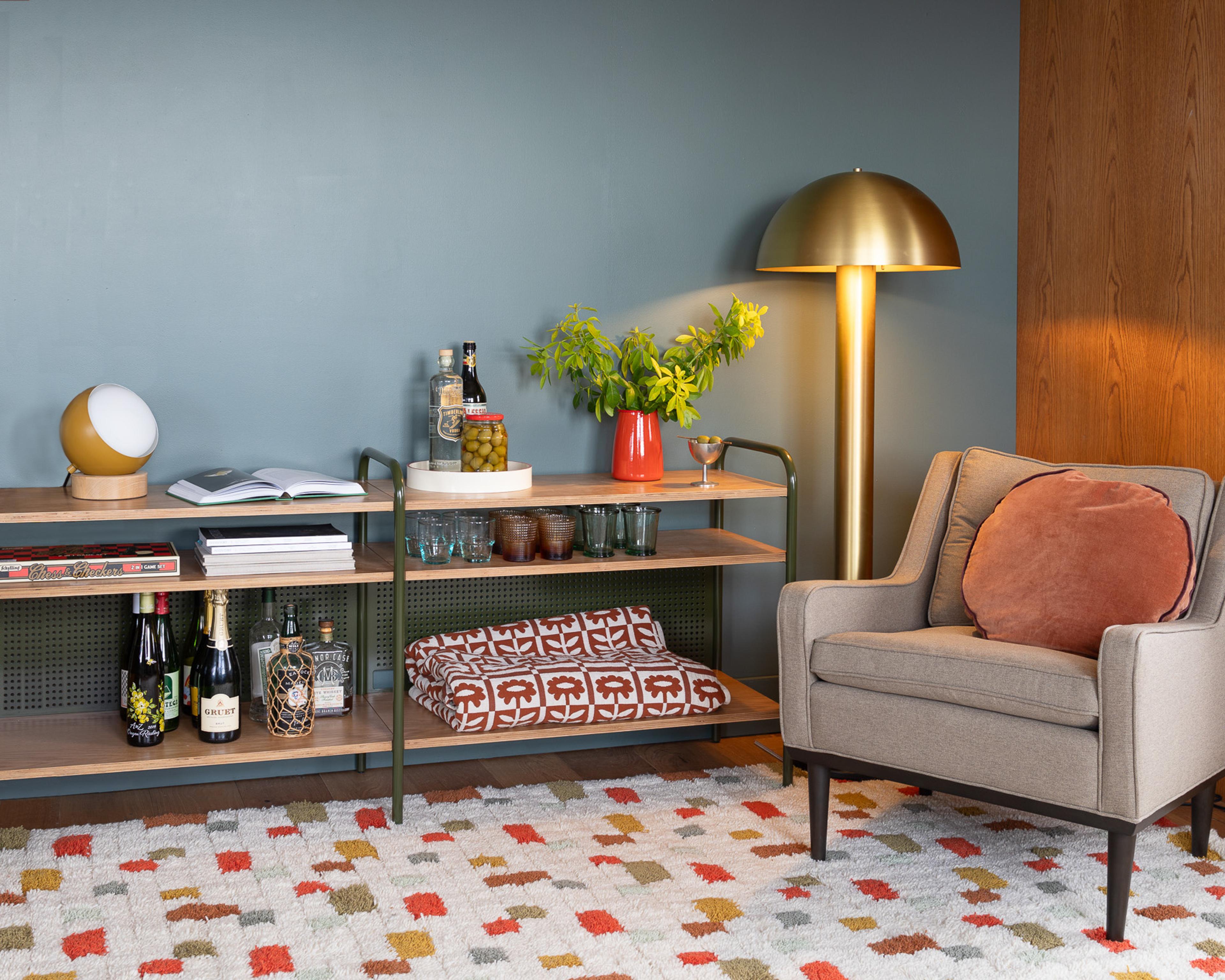 Eclectic living room with brass floor lamp and pixel shag rug