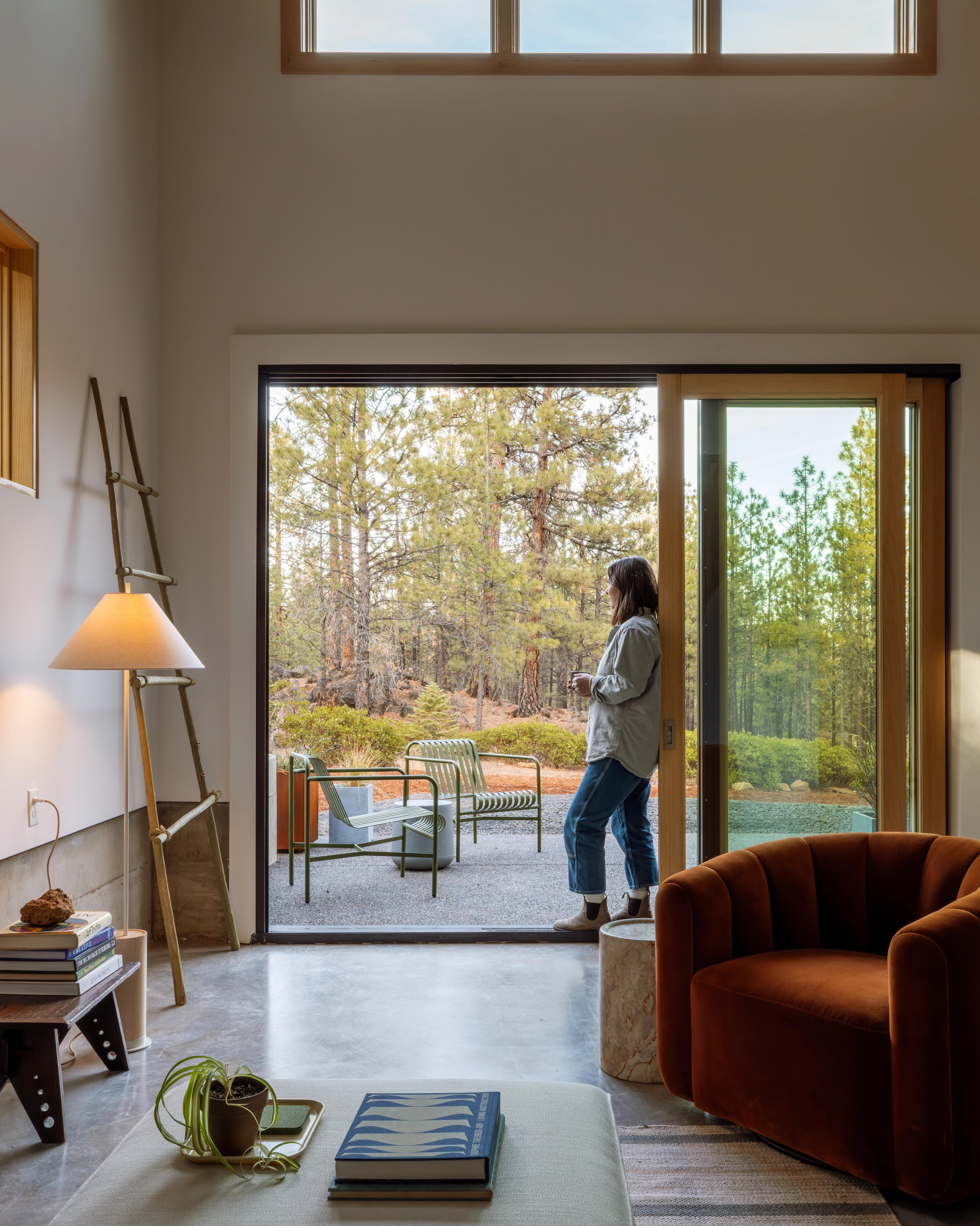 Woman standing outside door.