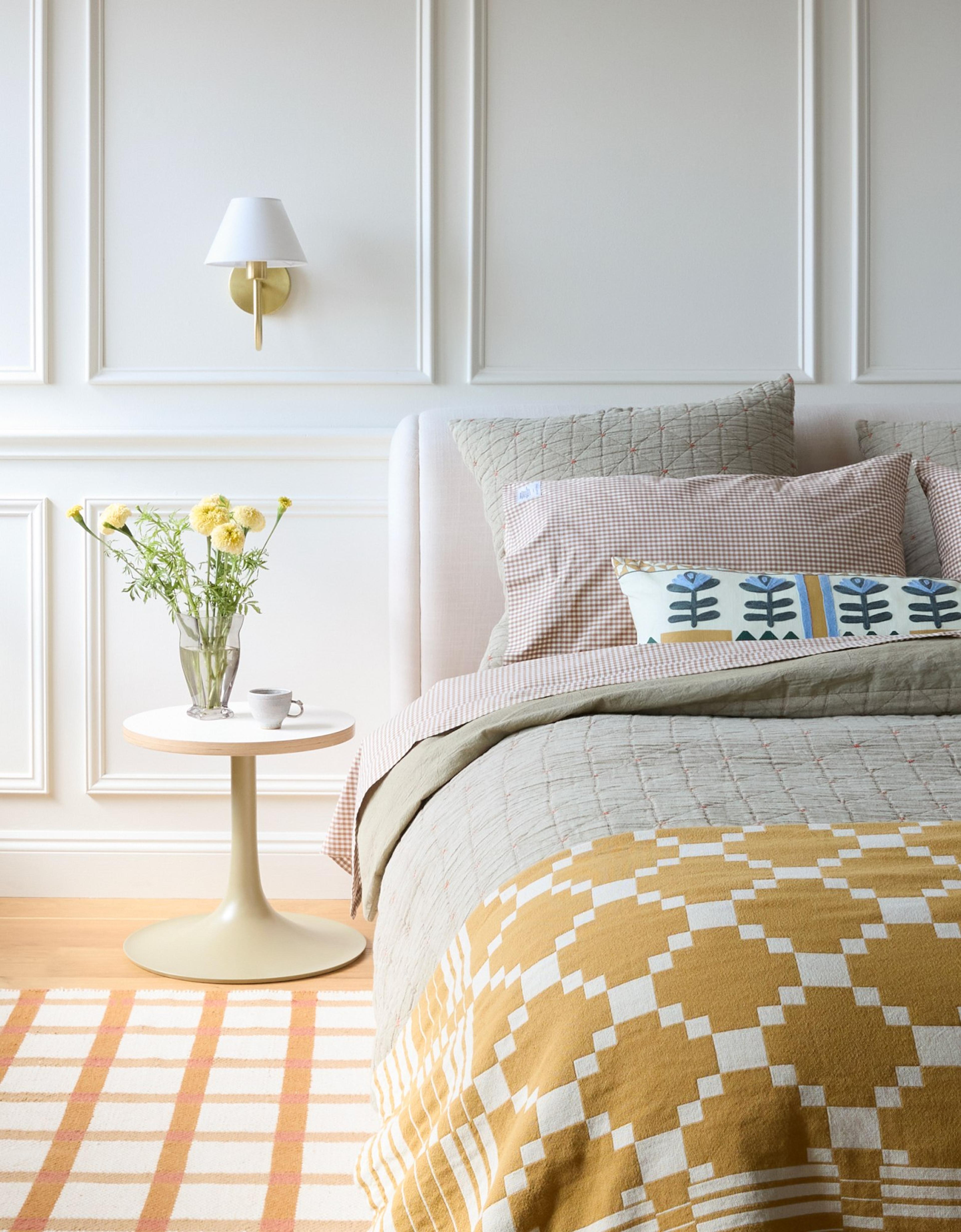 sunny bedroom with yellow bedding