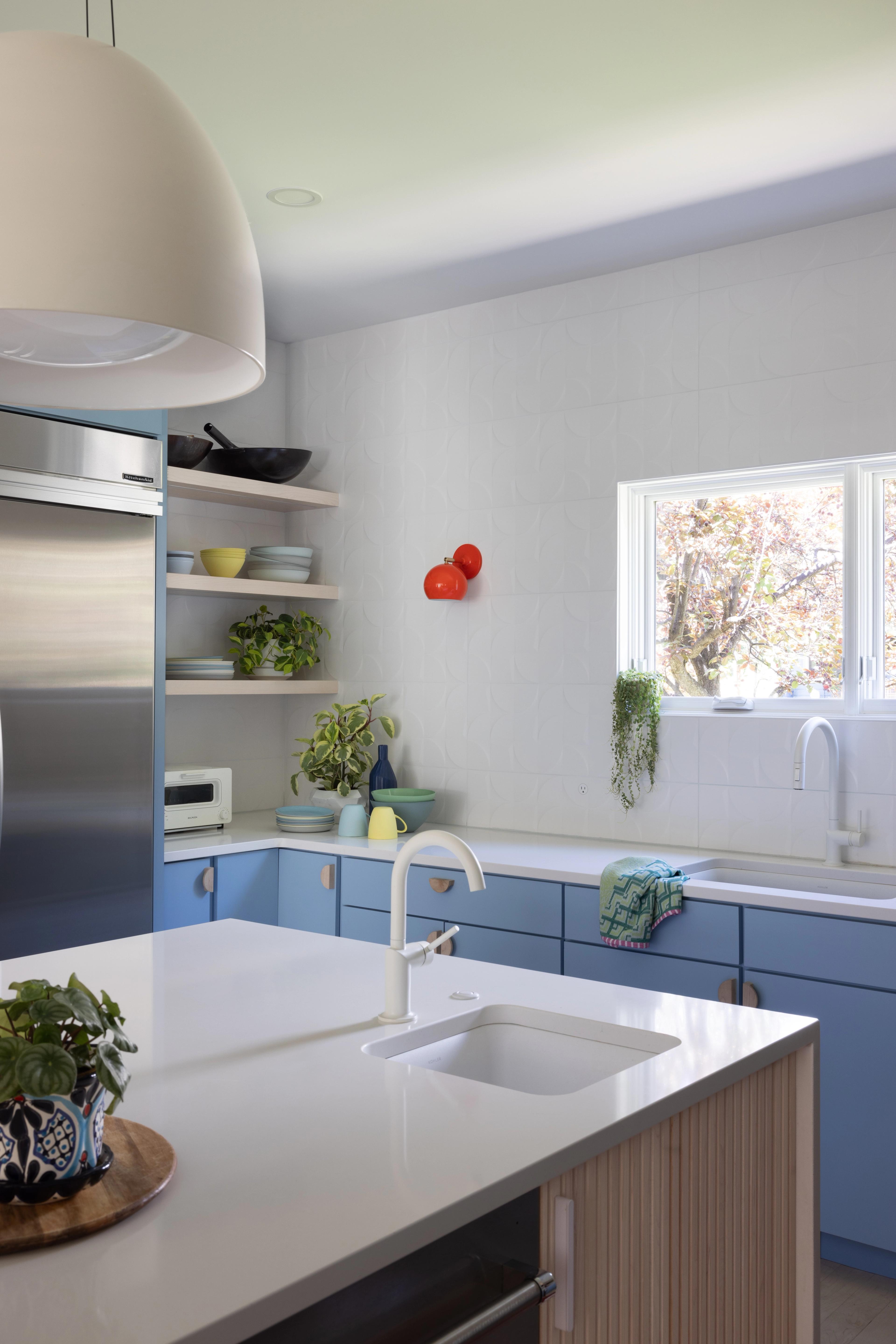 Red sconce in kitchen. 