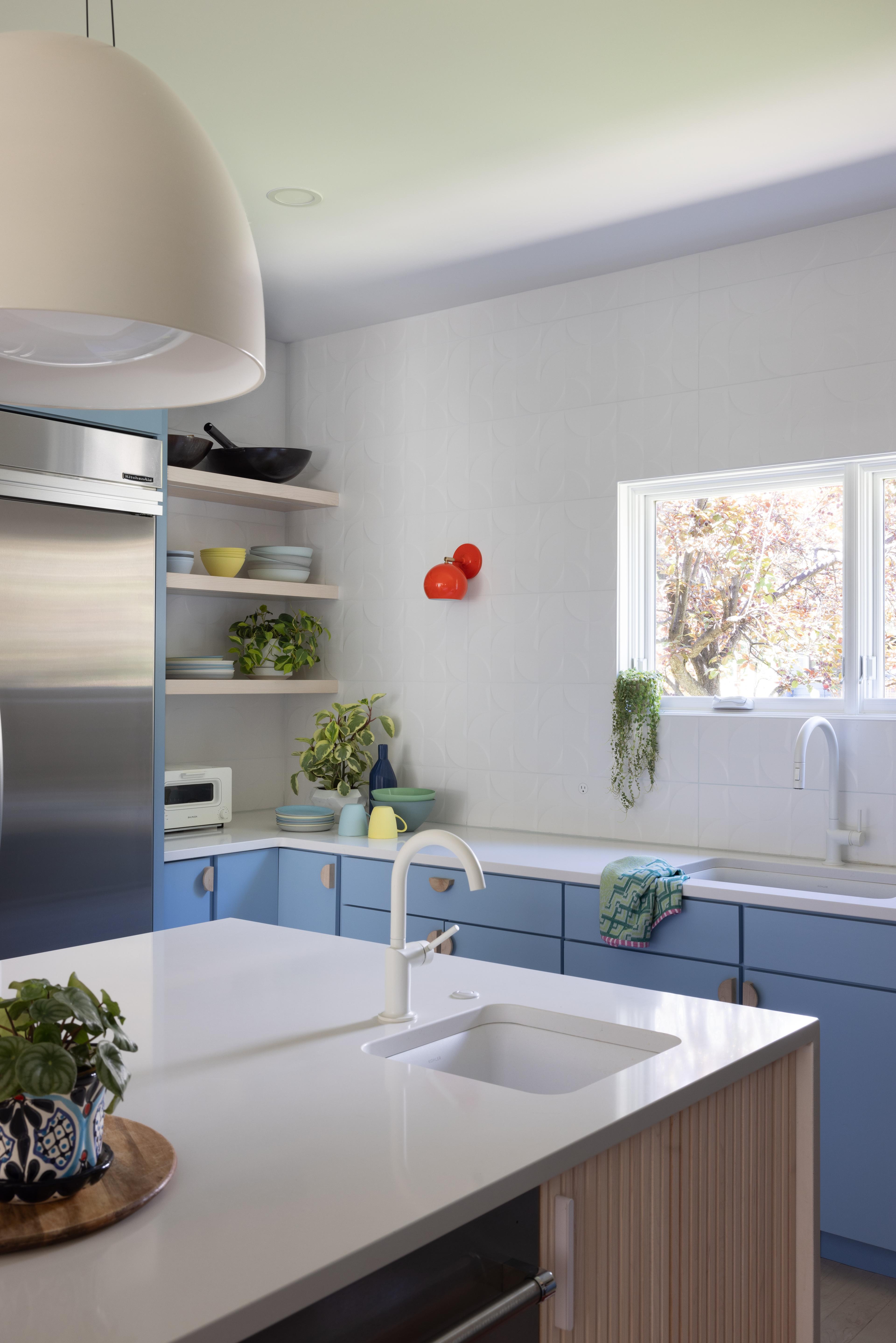 Red sconce in kitchen.