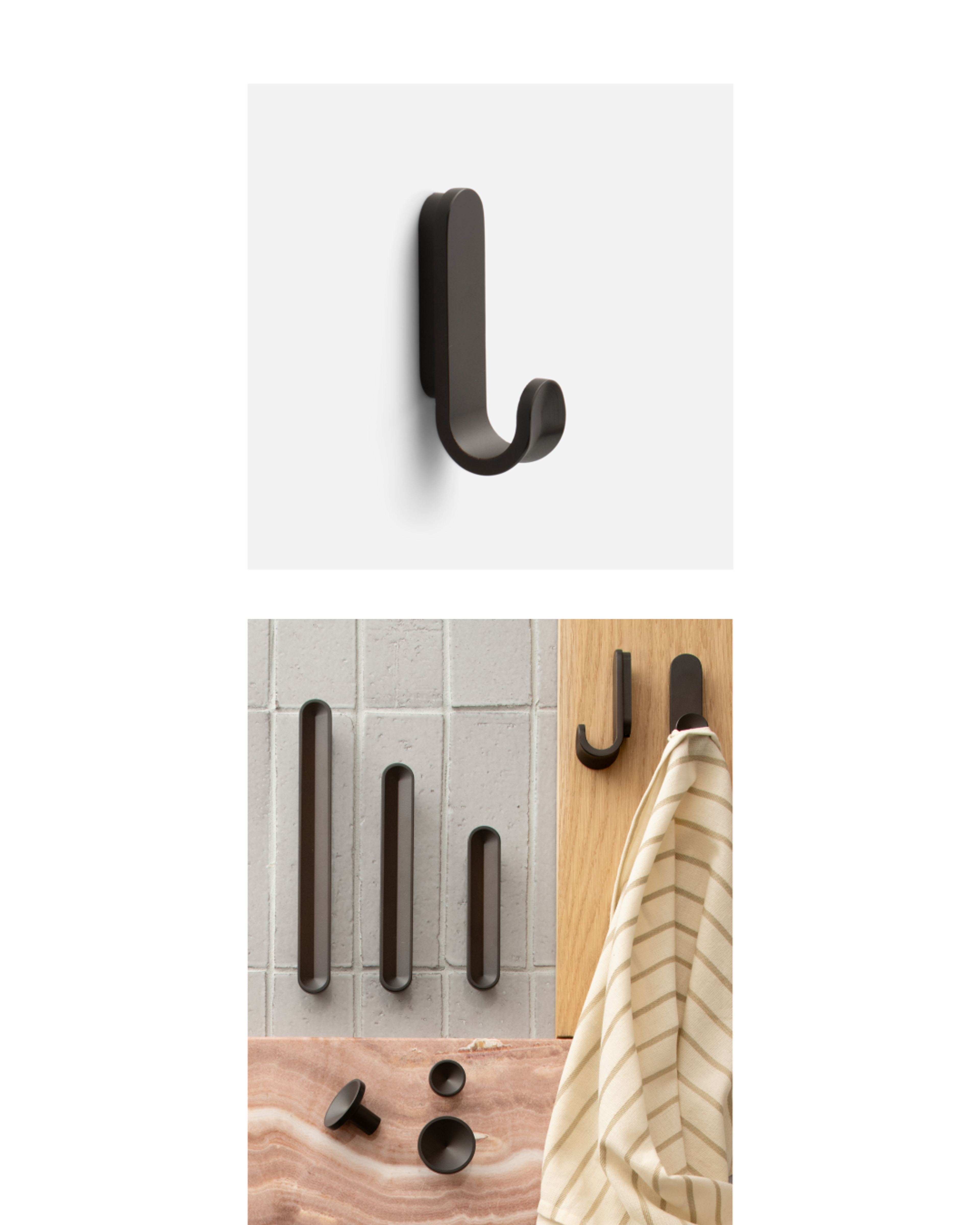 Black pulls, hook and knobs on white background and tiled surface