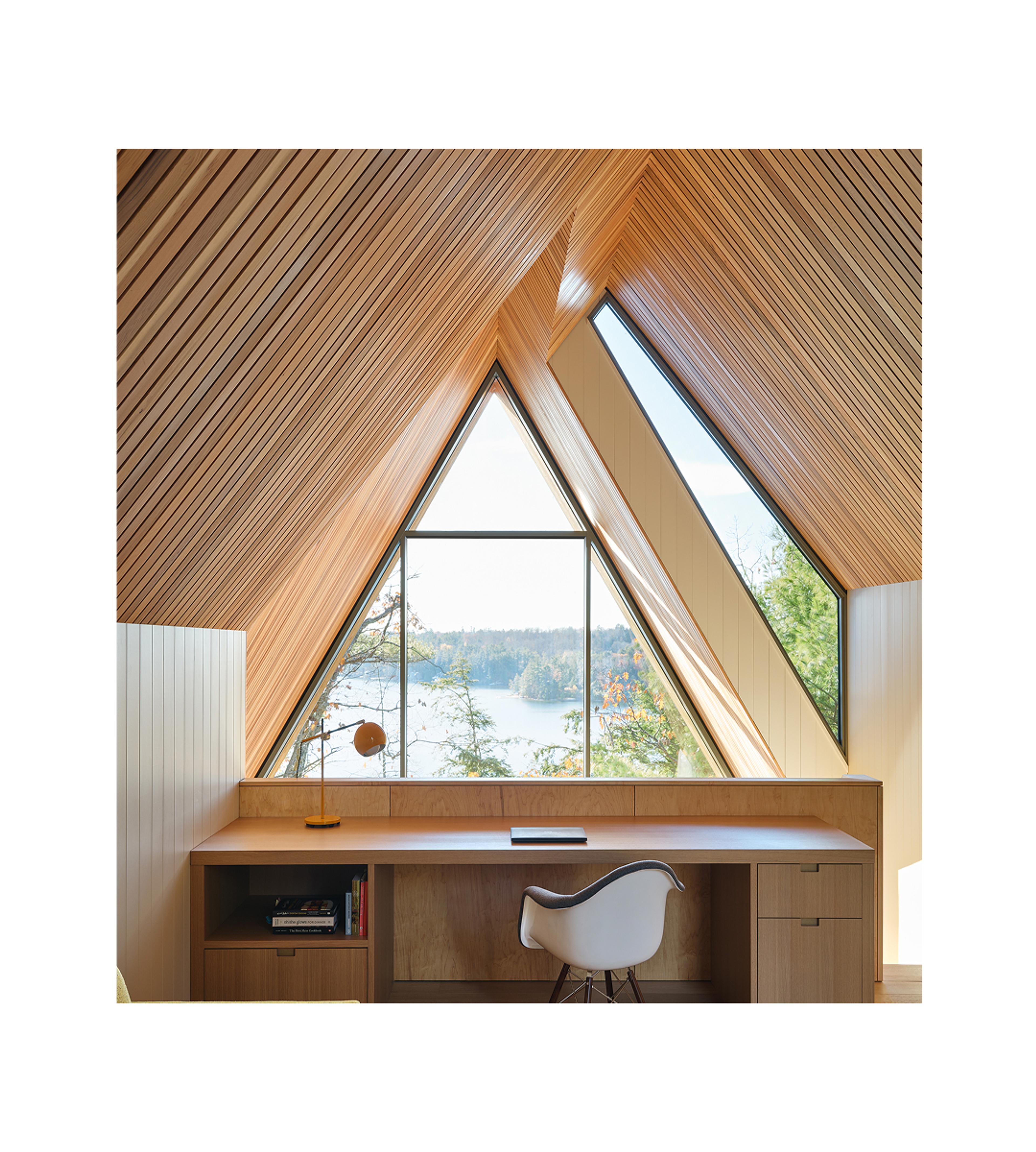 Desk with a large window in front of it.