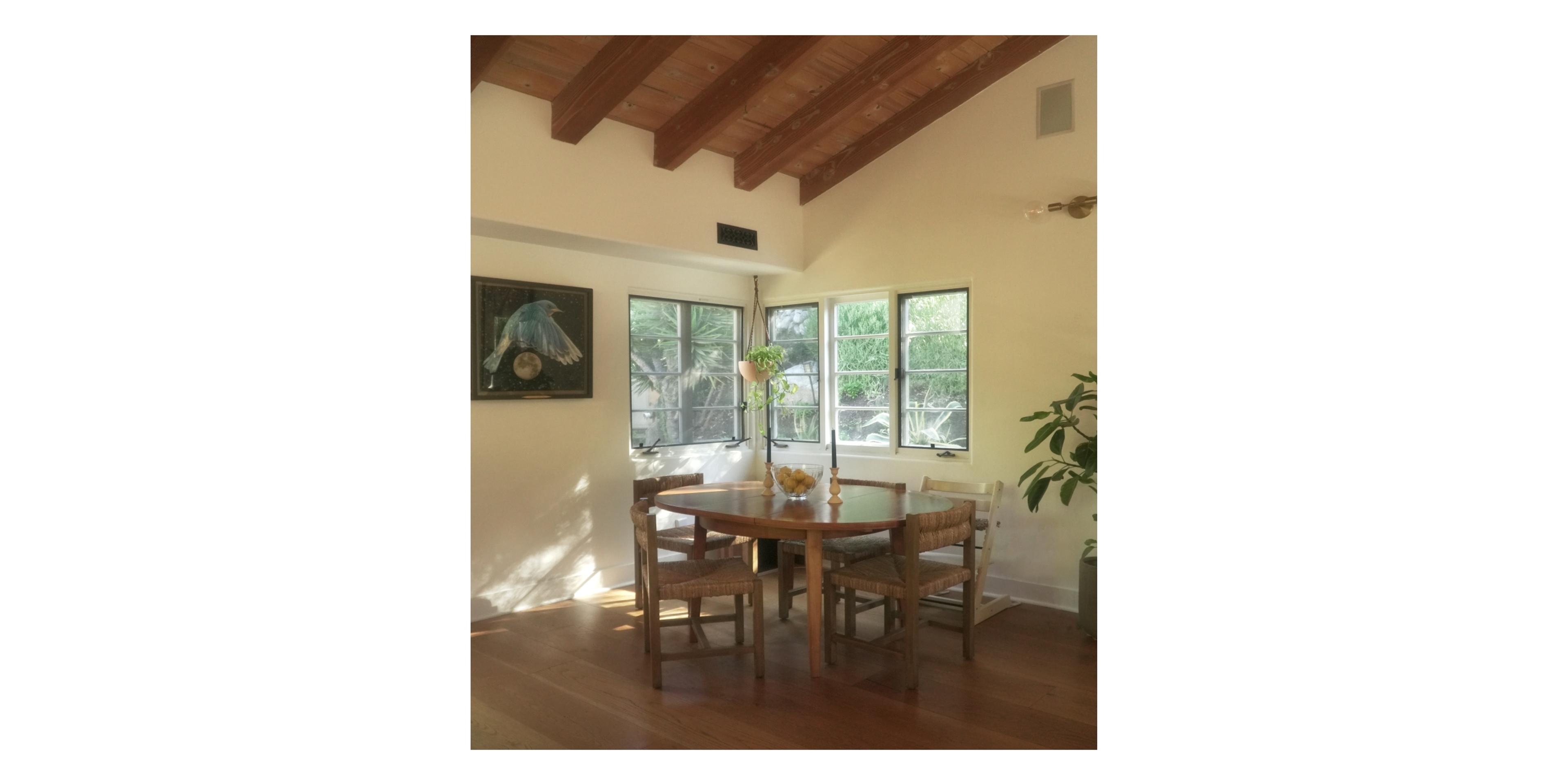 dining nook with wooden table and chairs 