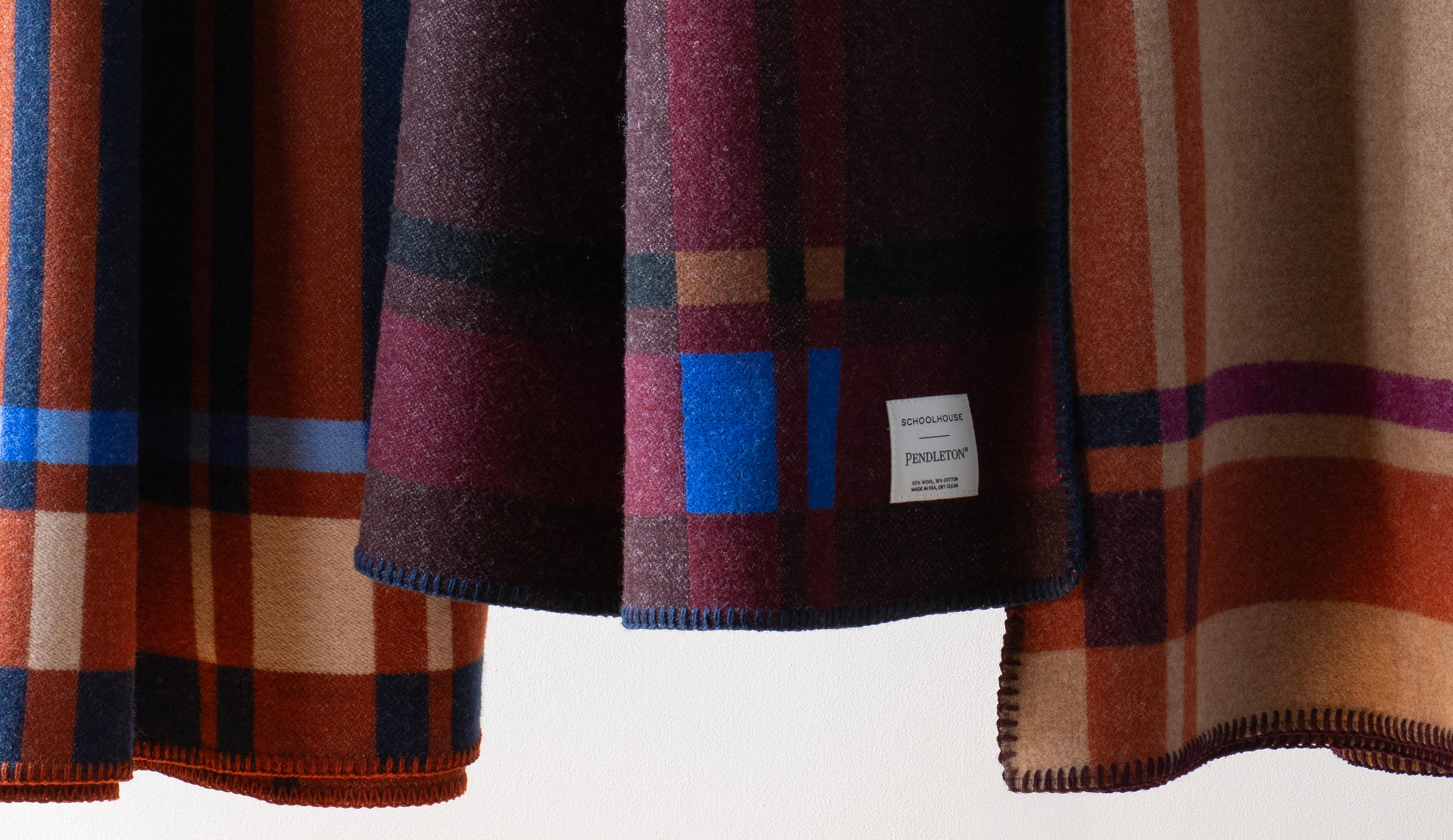 Plaid blanket on a sofa.