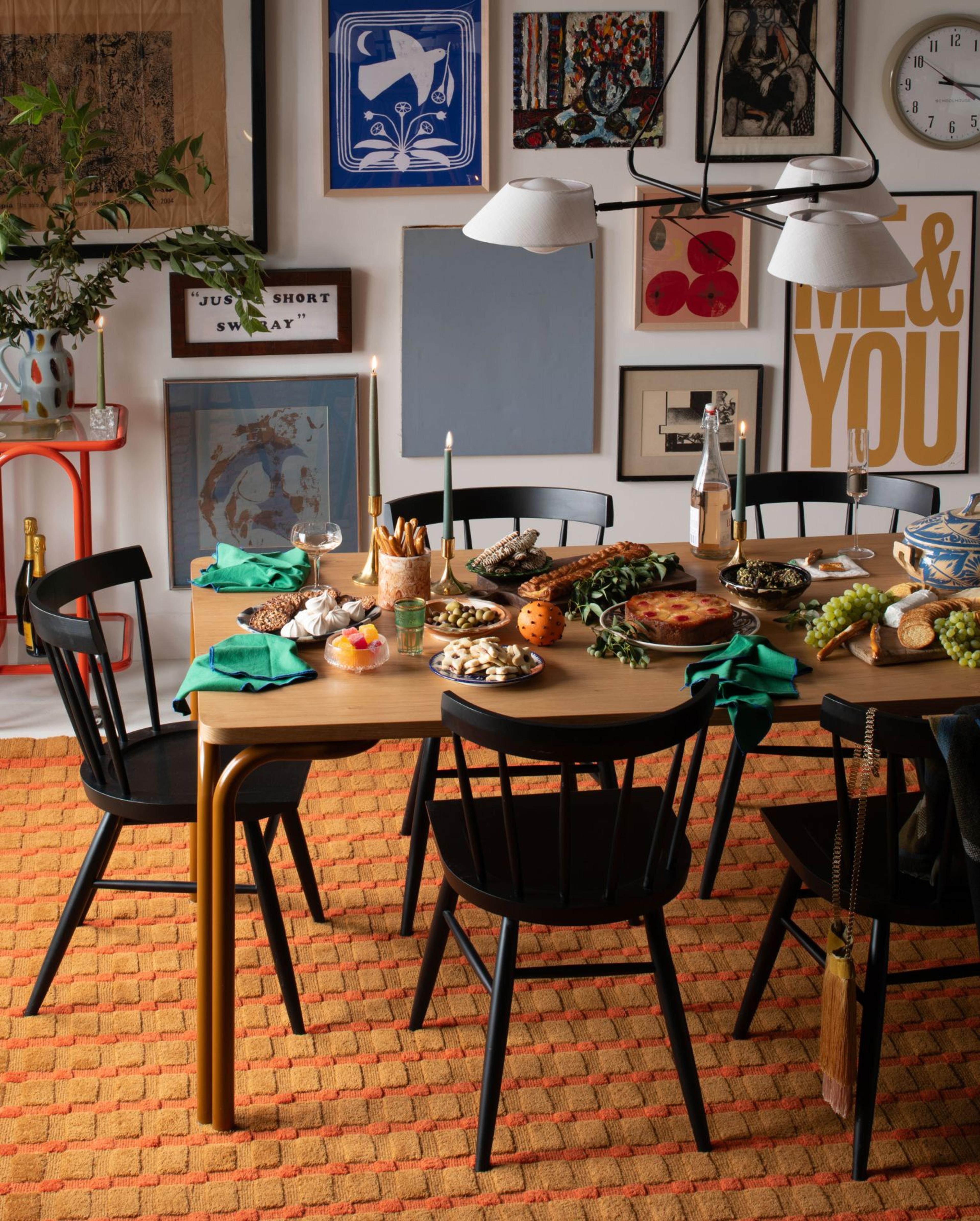 Dining table set for a holiday meal in a heavy decorated room