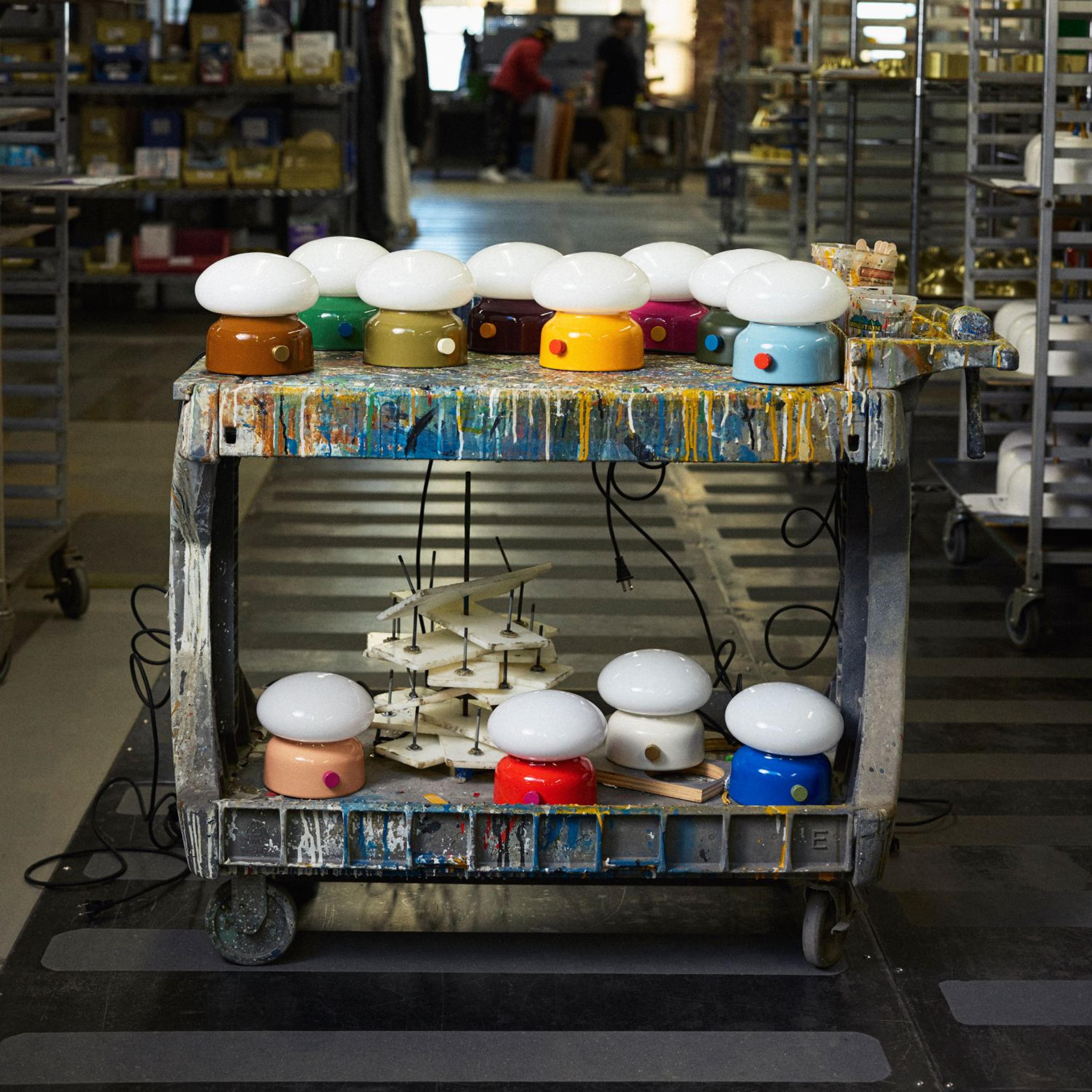 Teig lamps sitting on a paint cart