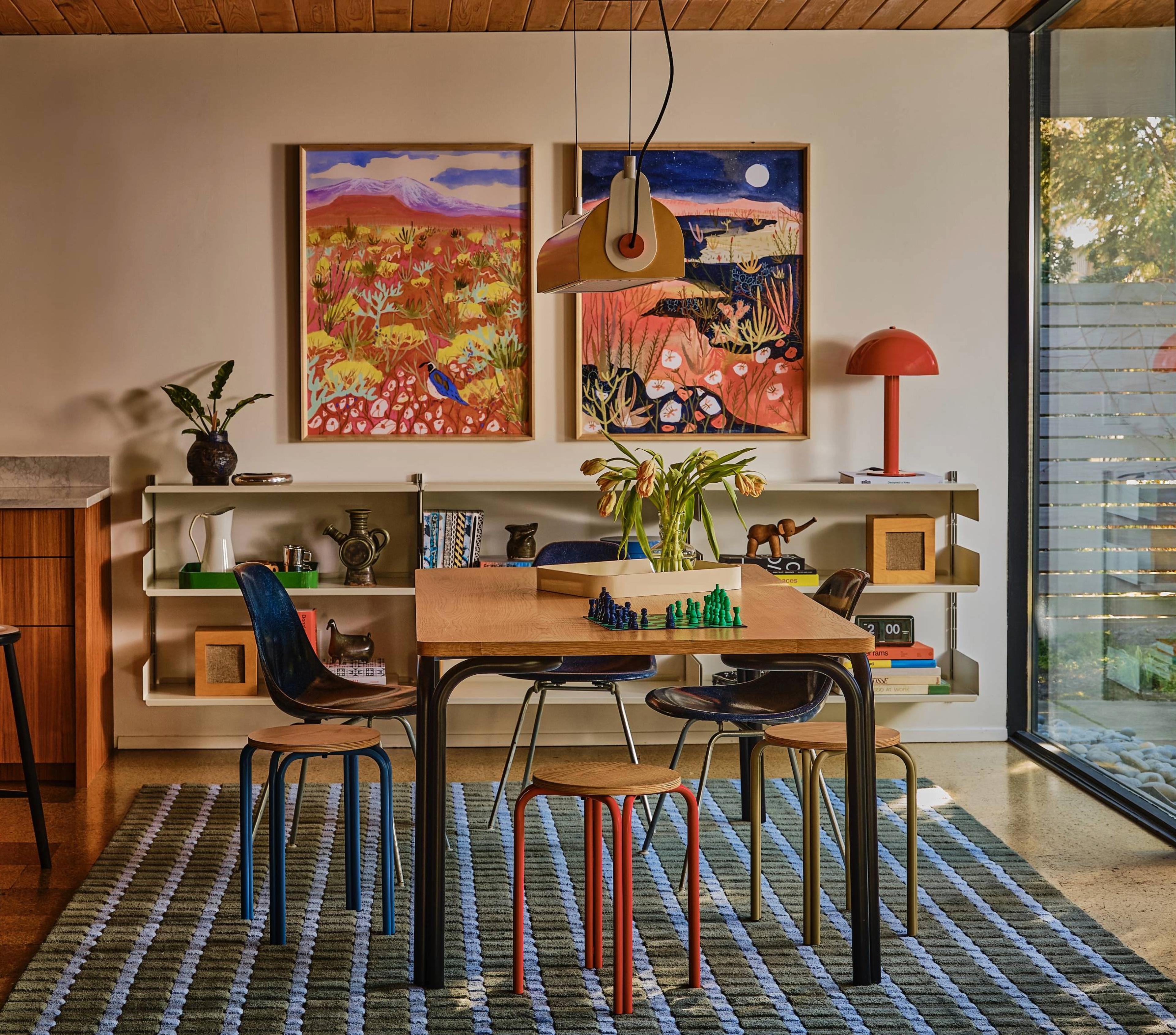 Modern dining room with pendant hanging over table and shag plaid rug