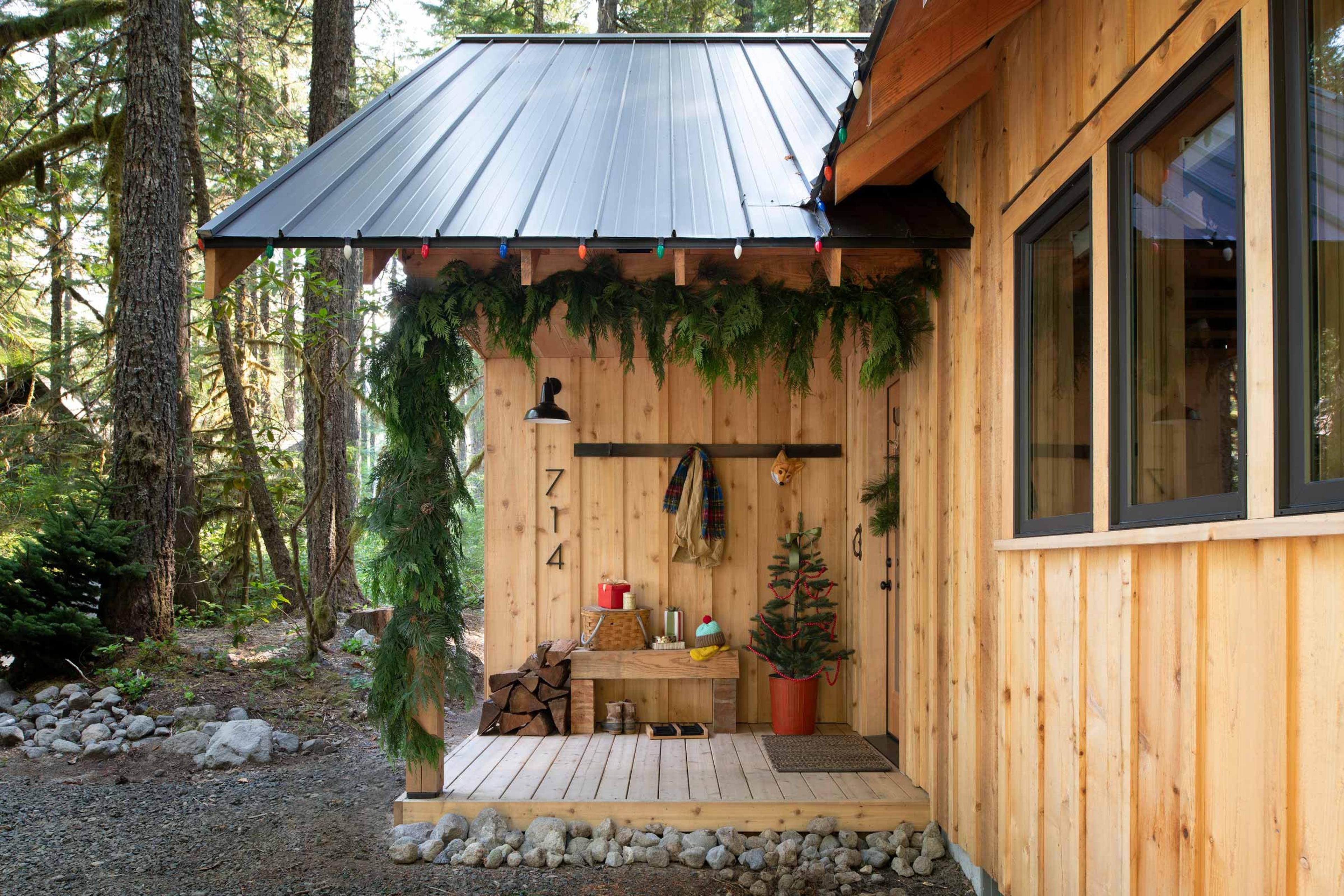 Cabin exterior decorated for the holiday season.