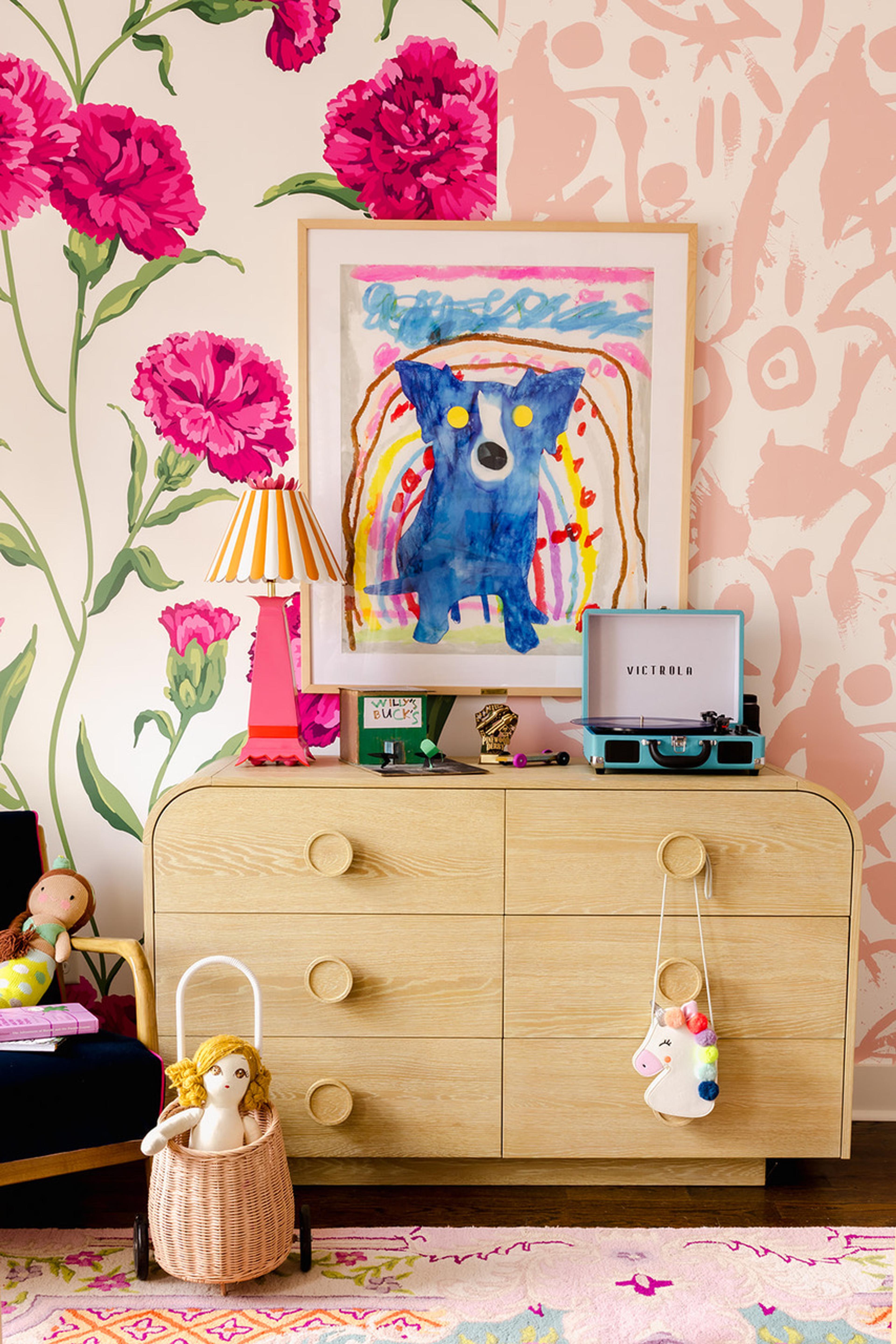 Childs room with floral wallpaper, chest of drawers and dog painting