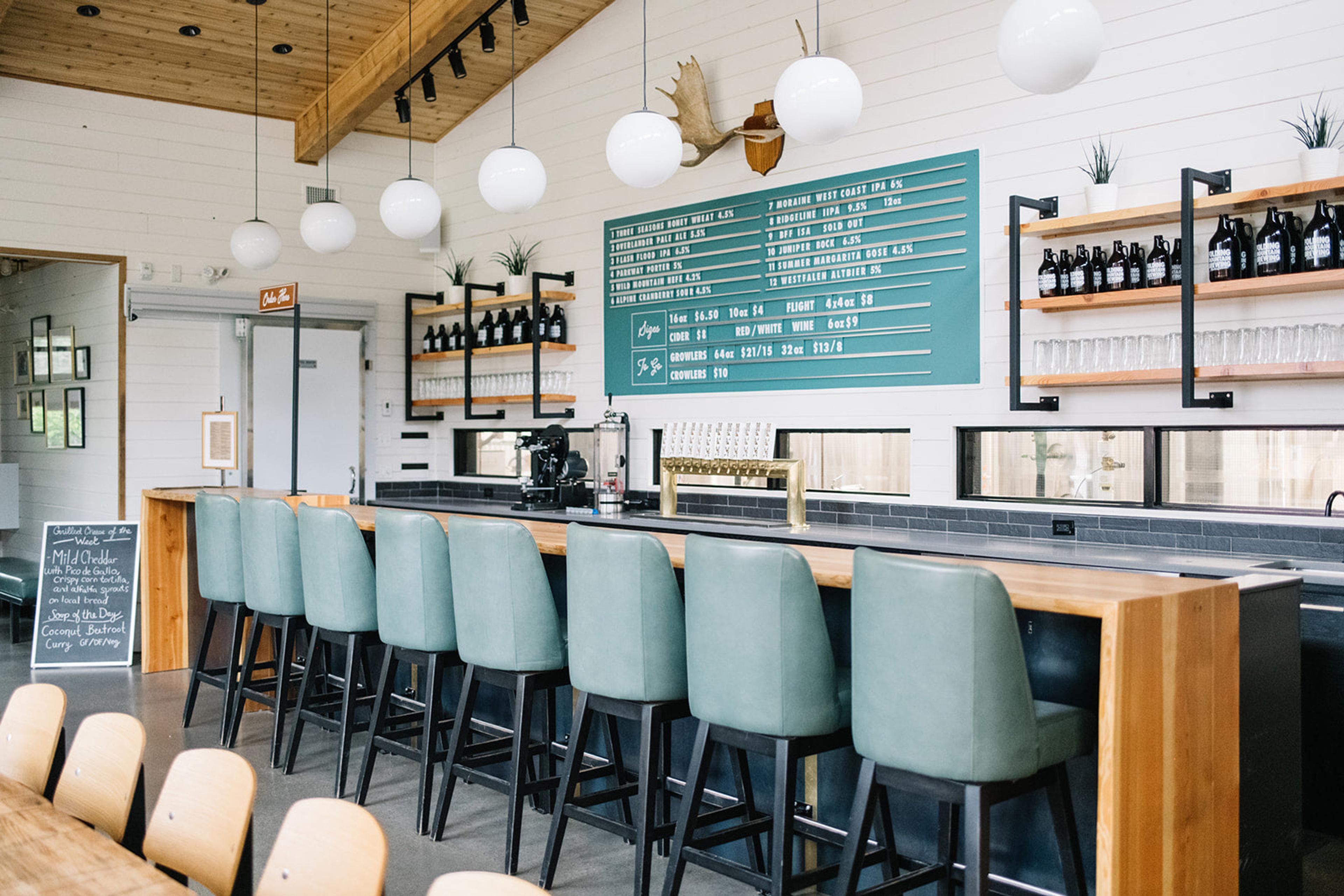 coffee shop with blue chairs and ceiling light fixtures