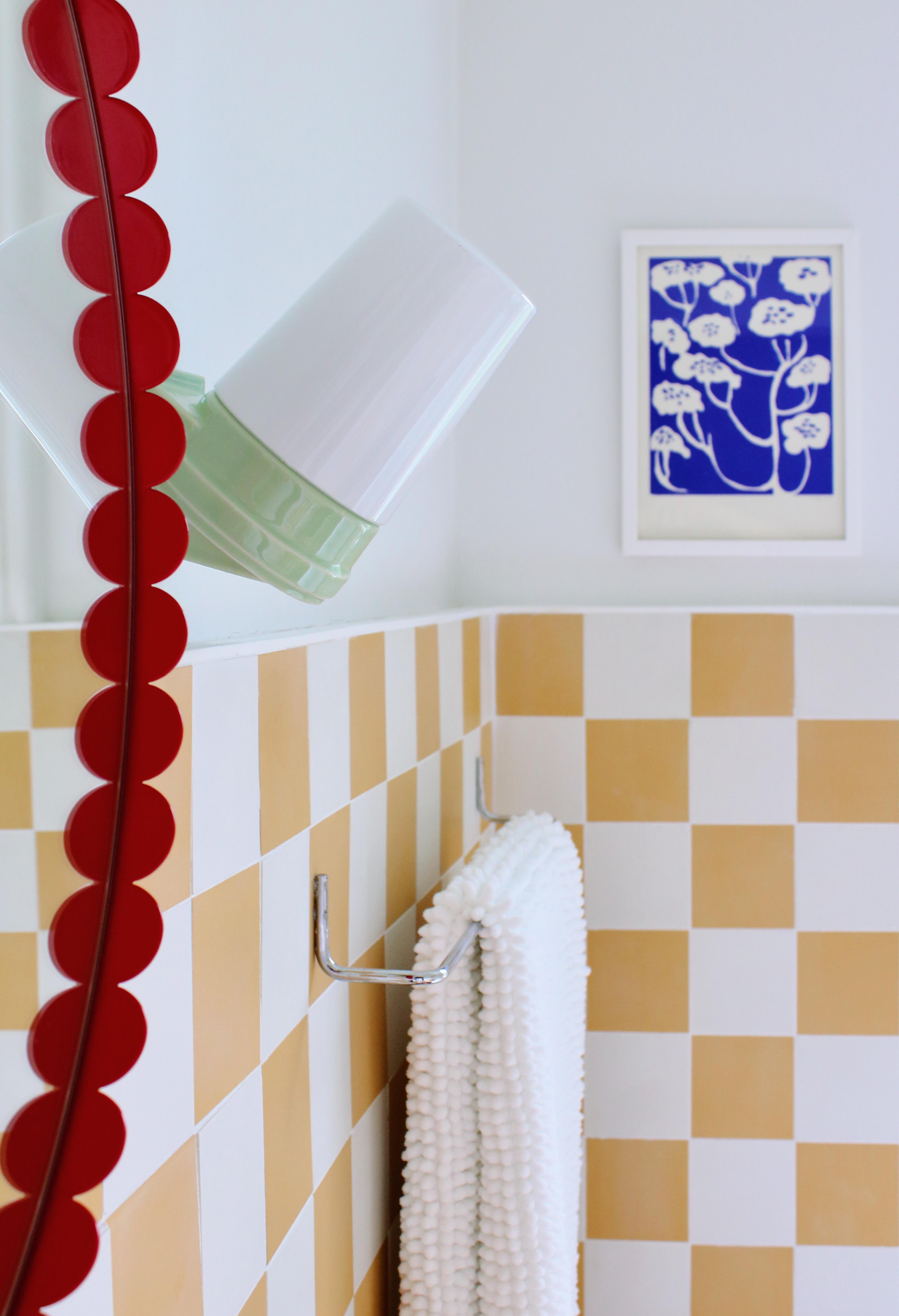 before and after of bathroom with yellow tiles 