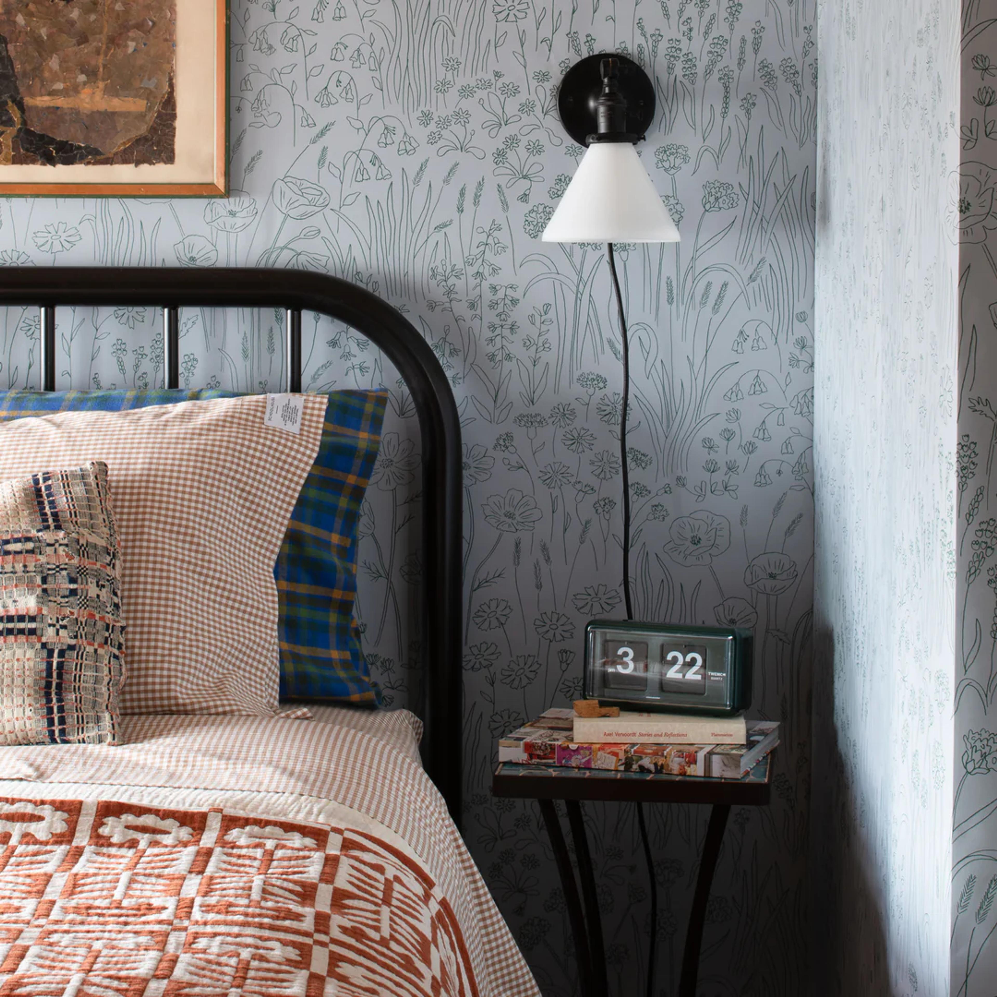 Floral wallpaper in bedroom. 