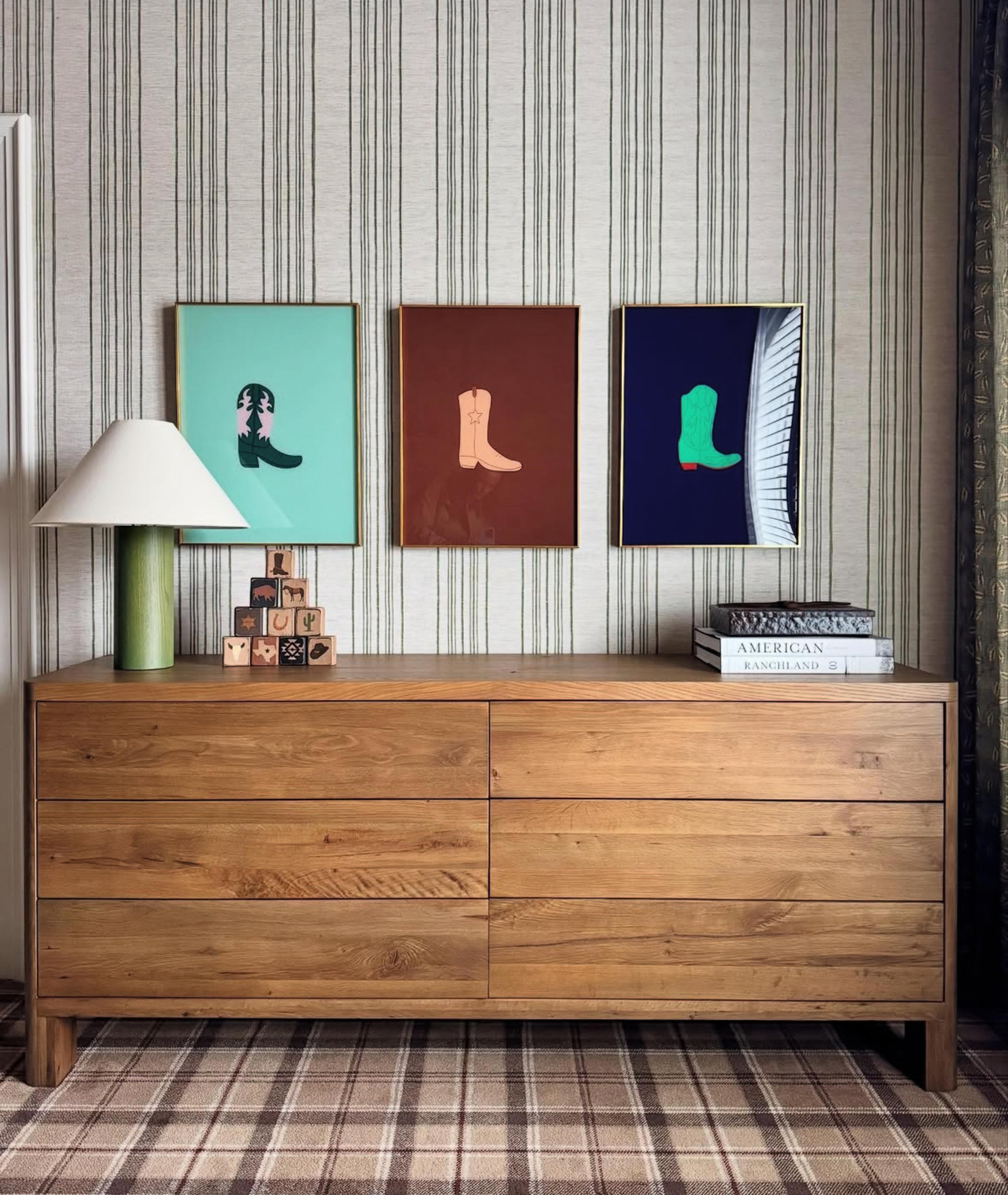 Sideboard with wallpaper behind it. 