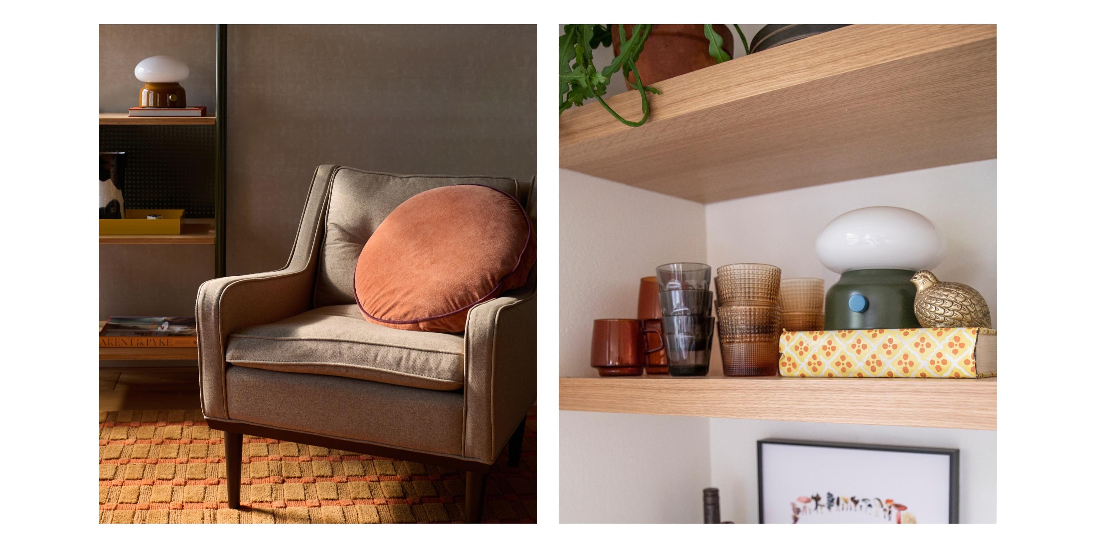 reading corner with beige chair and velvet circle pillow and green lamp on shelf with books and decor