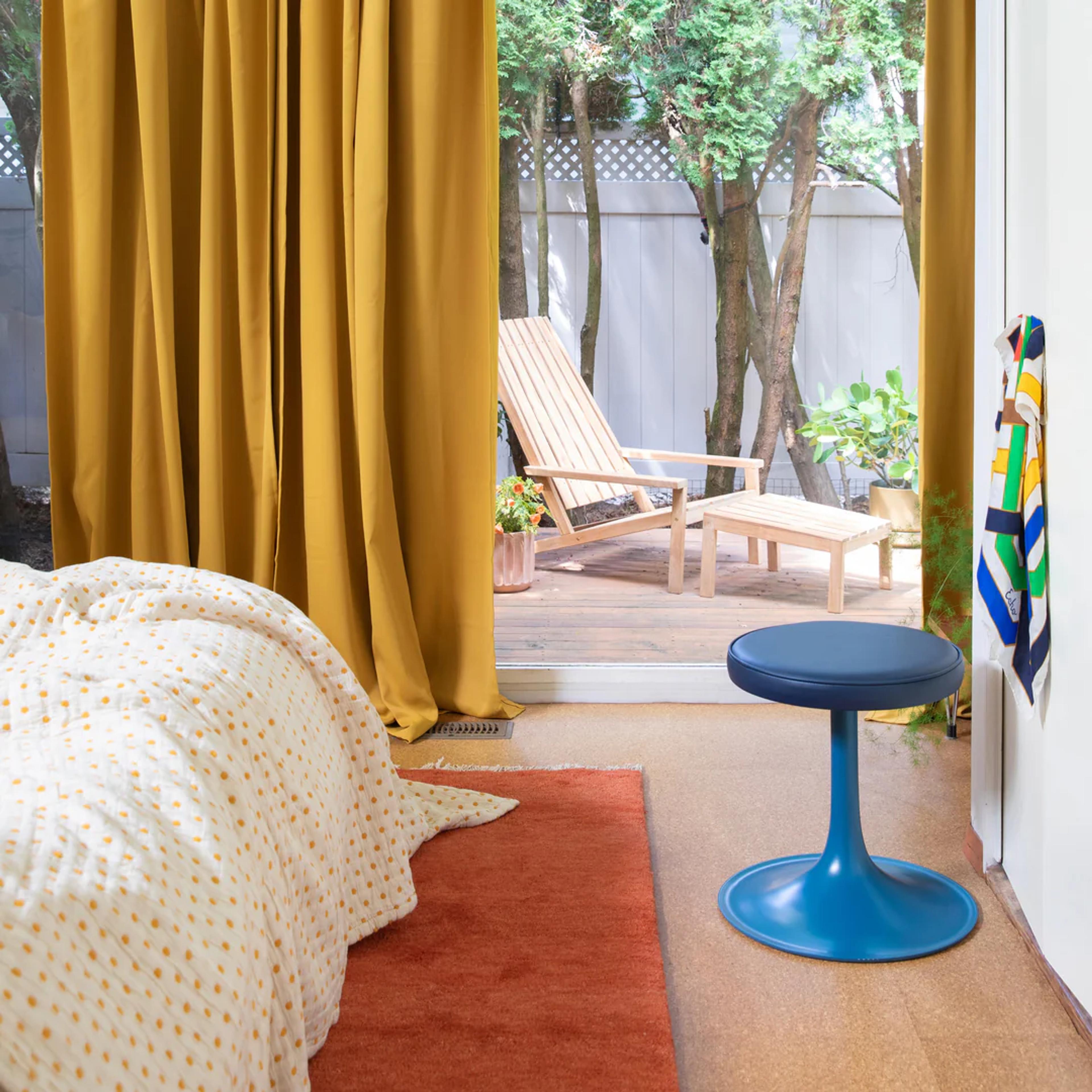 Polka dot quilt on bed. 