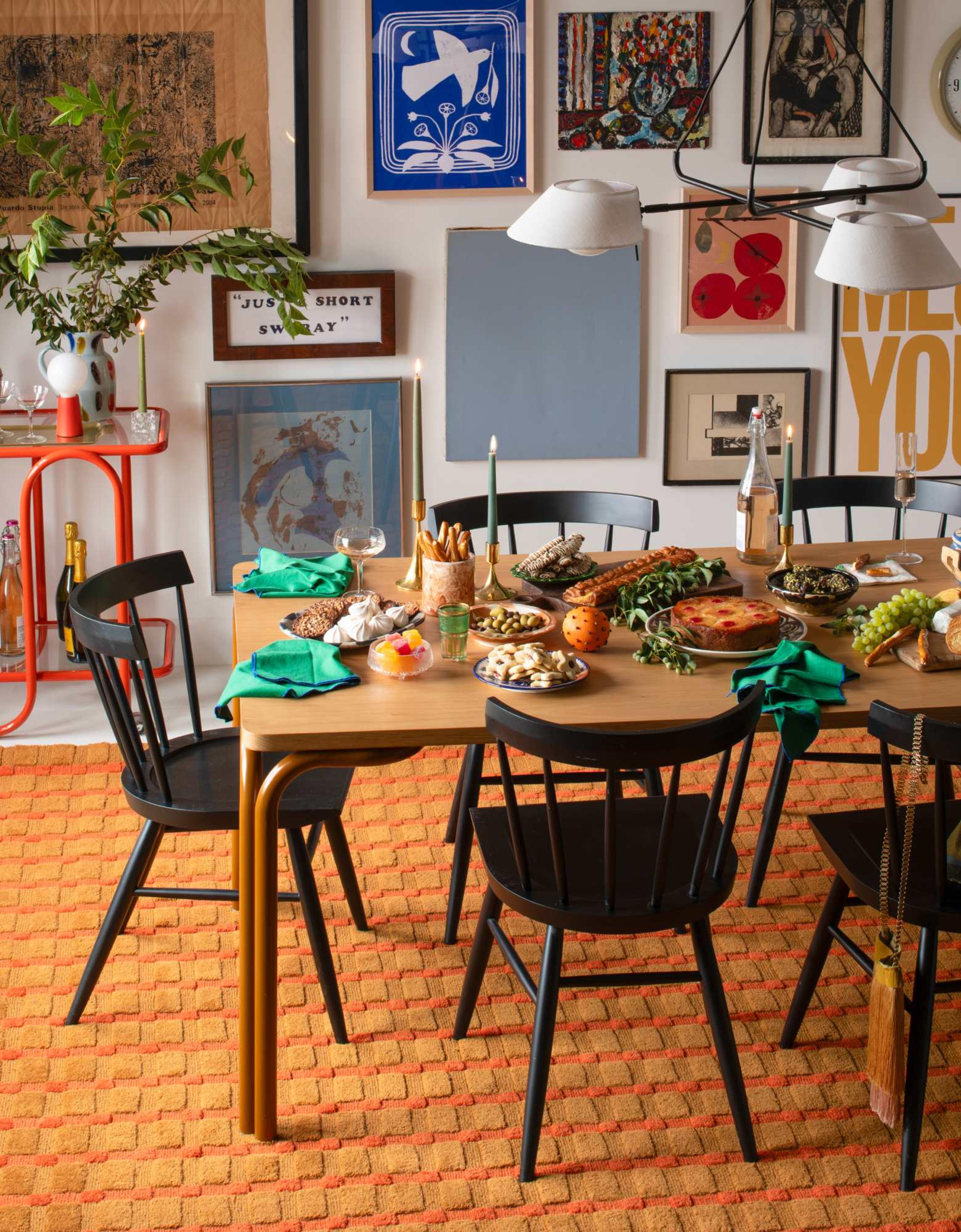 Dining table set for a holiday meal in a heavy decorated room