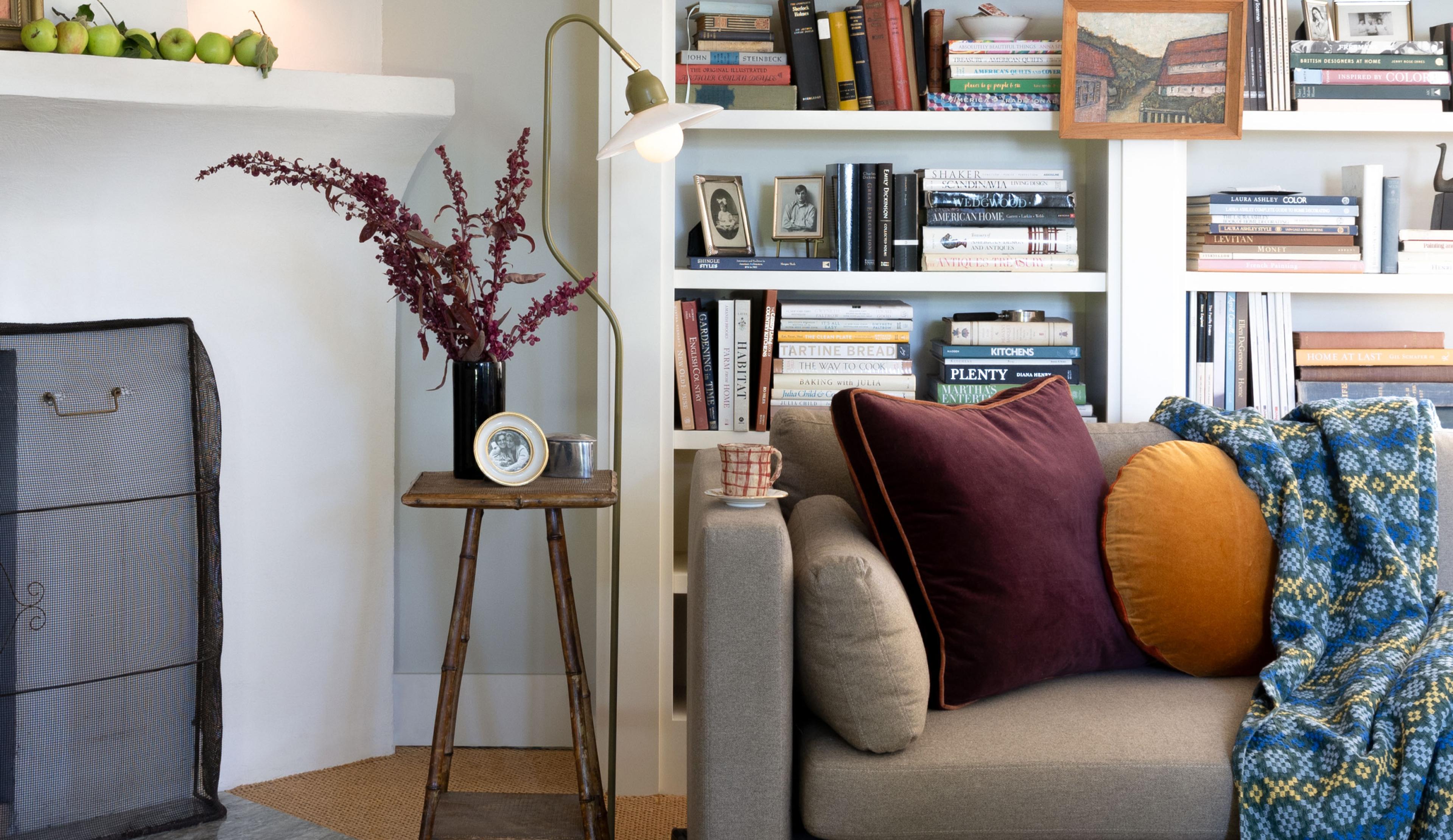 living room couch with colorful pillows floor lamp