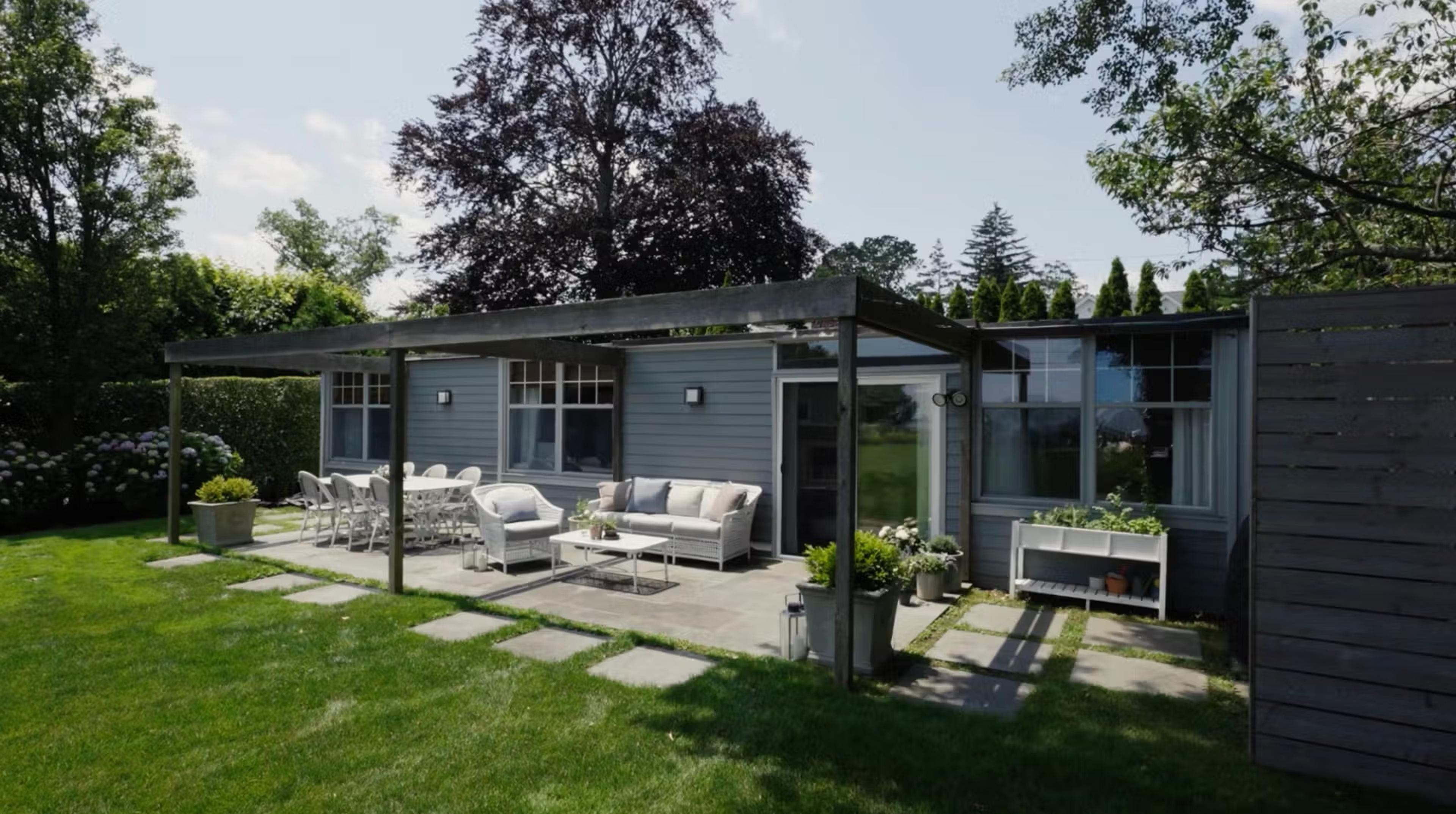 back patio of house with chairs 