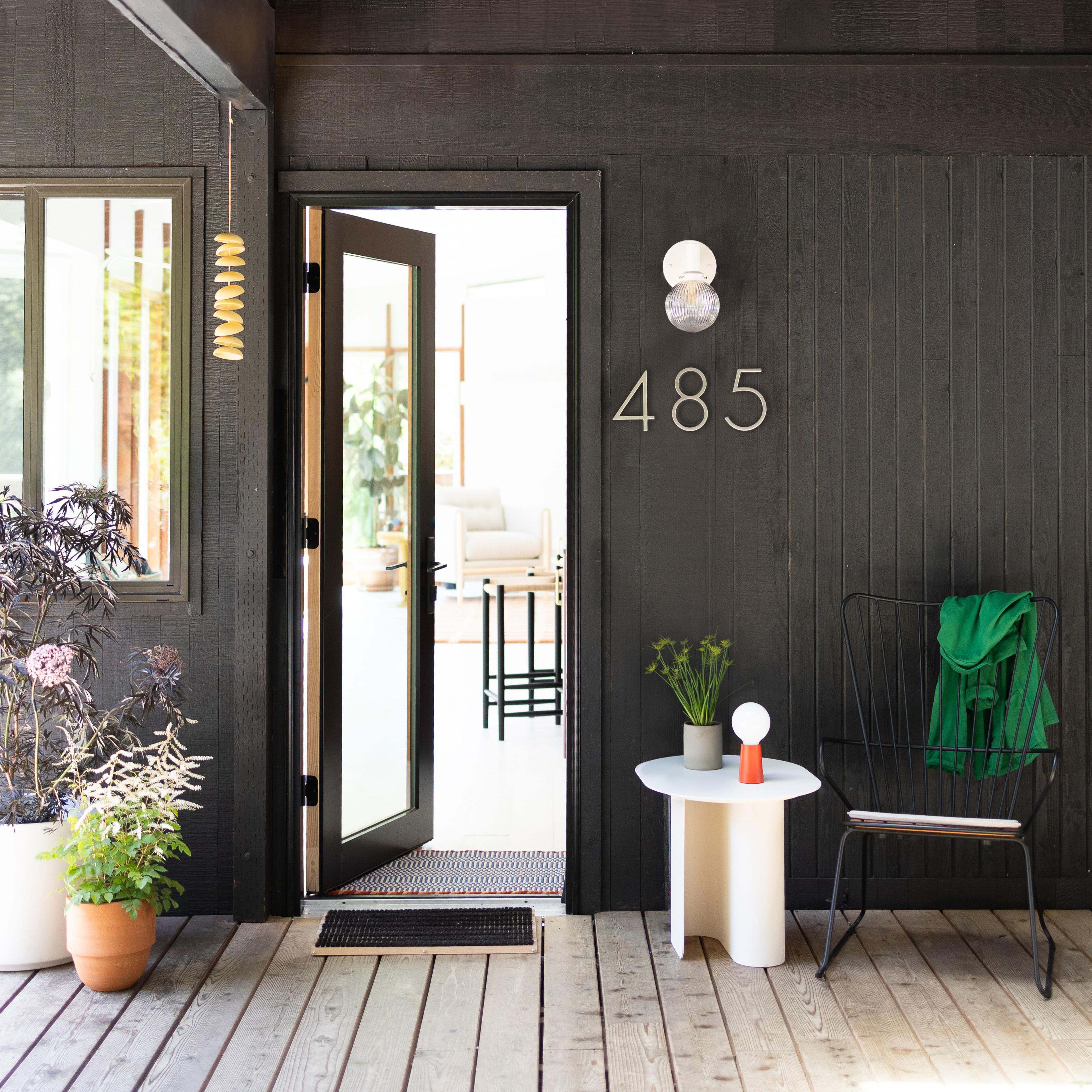 Entryway to dark modern home