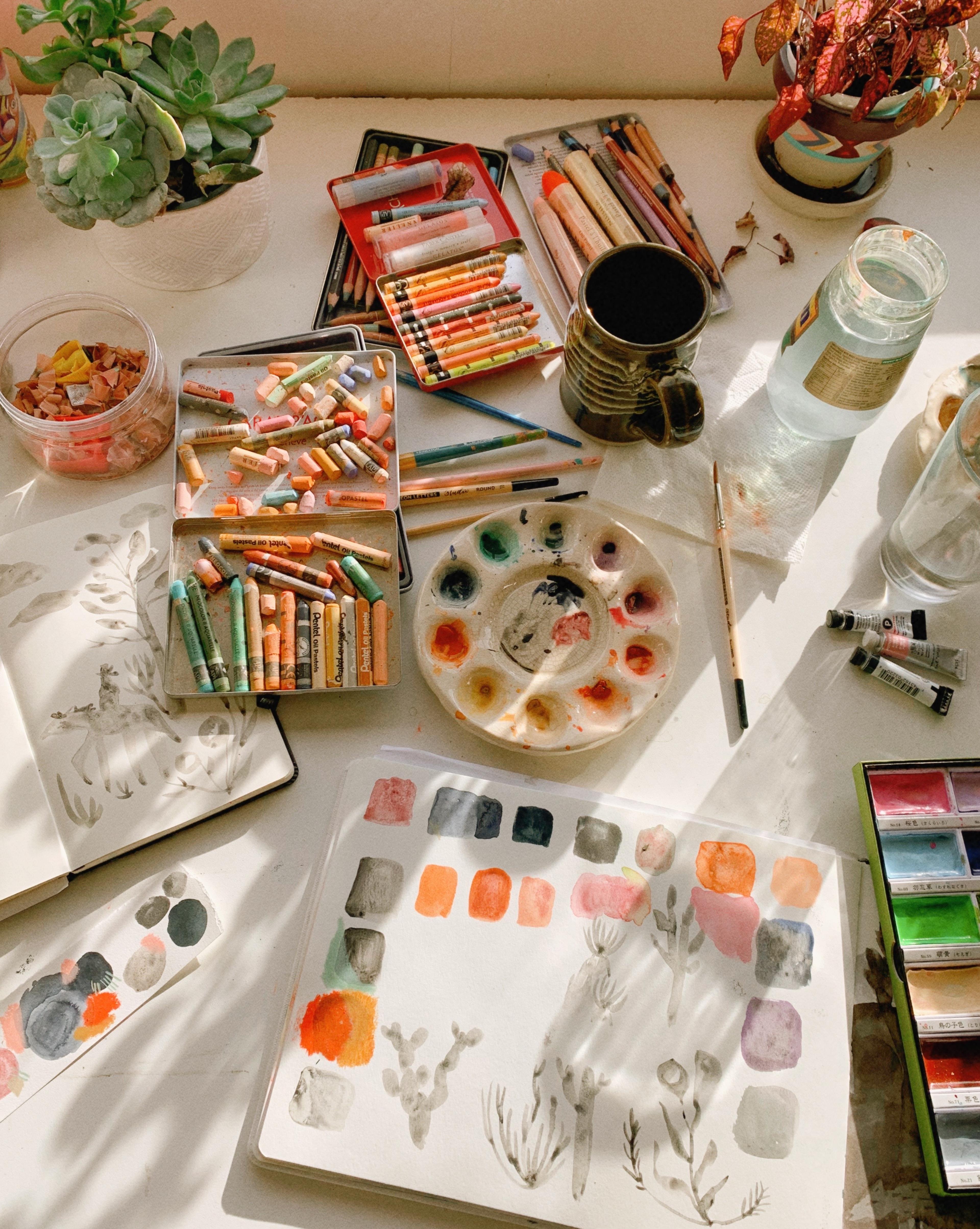 Overhead shot of painter's materials and sketch