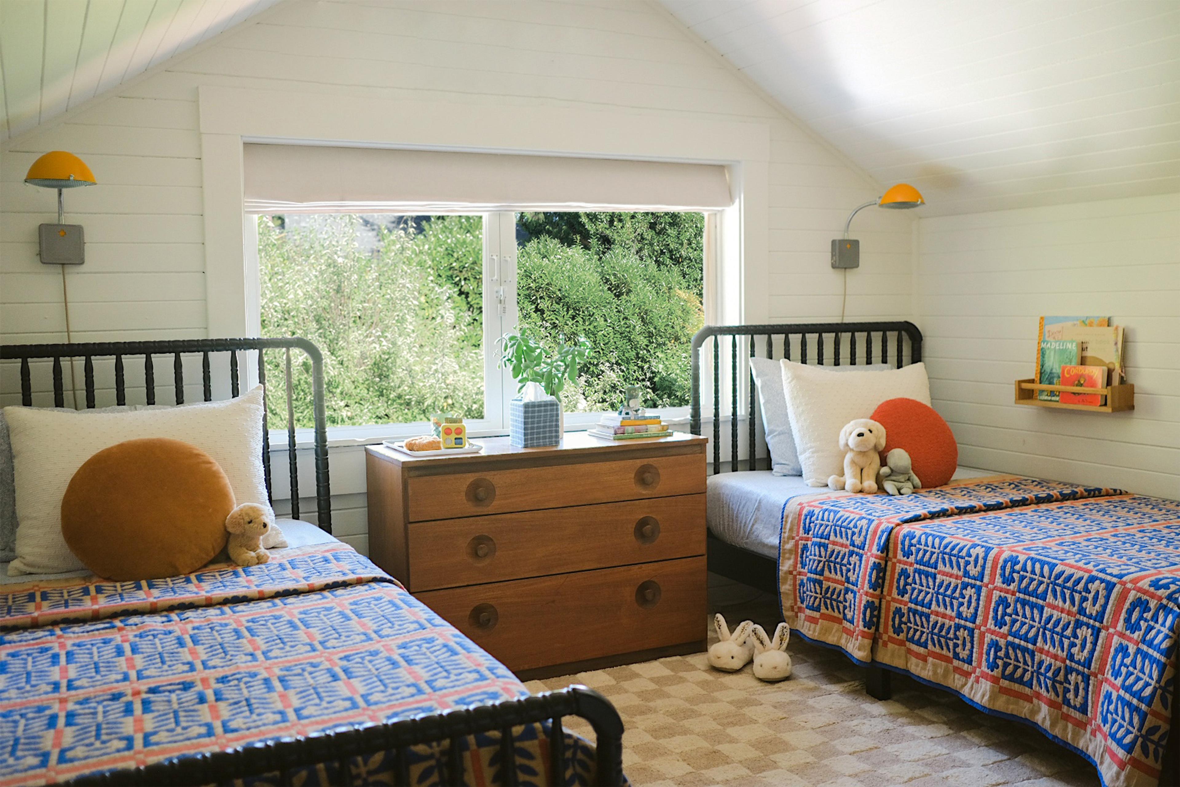 Two twin beds with matching quilts.