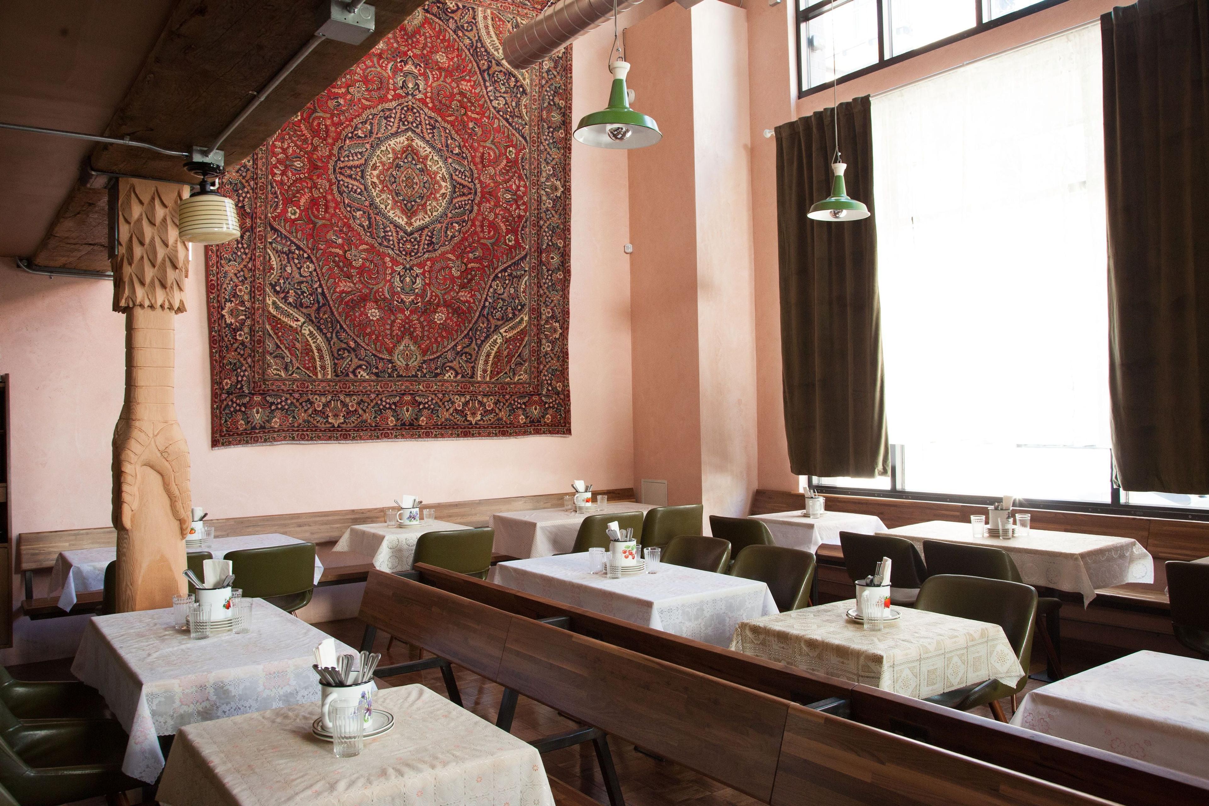 restaurant with tables and chairs and ceiling light fixtures