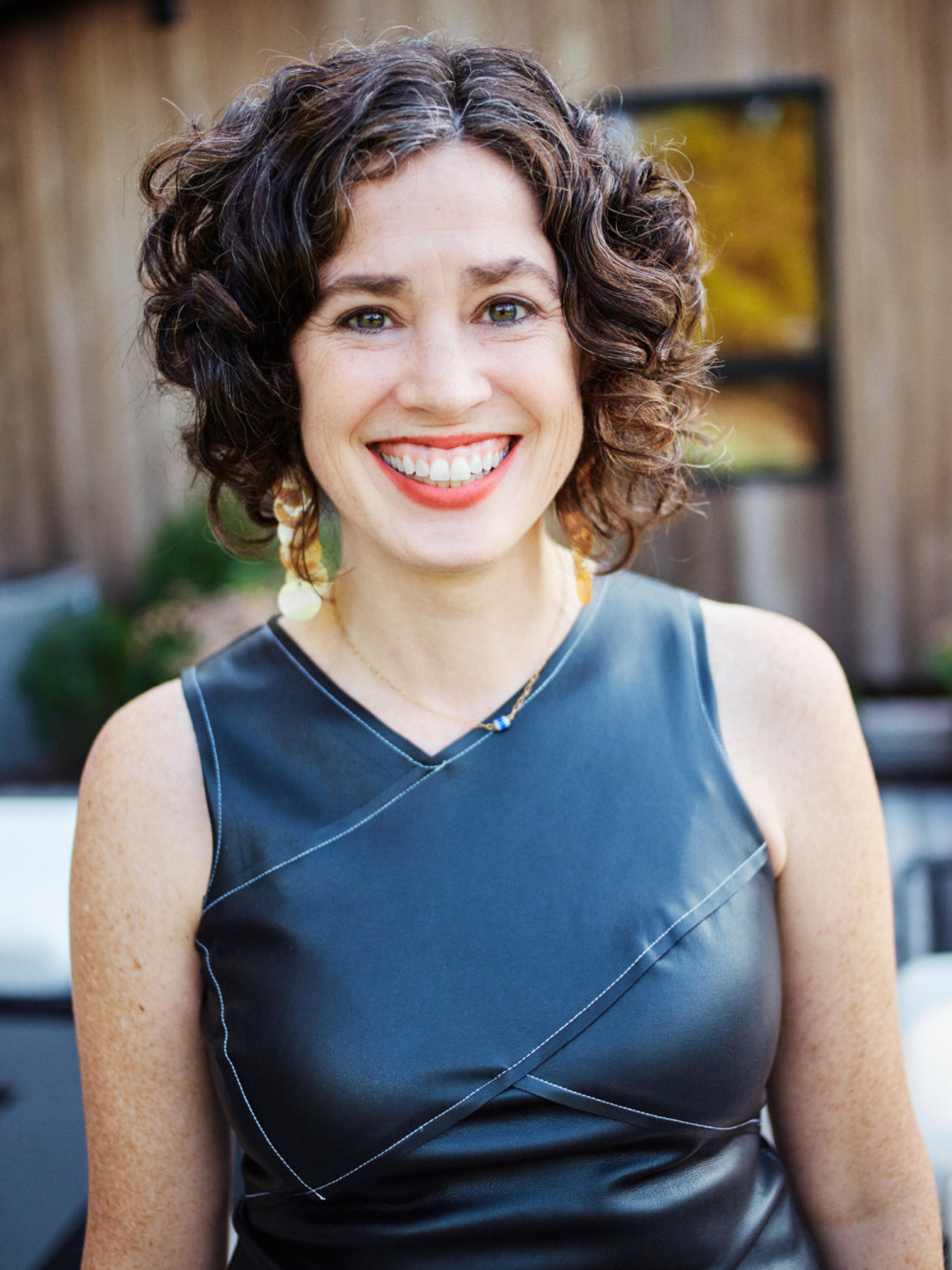 Woman posing and smiling. 