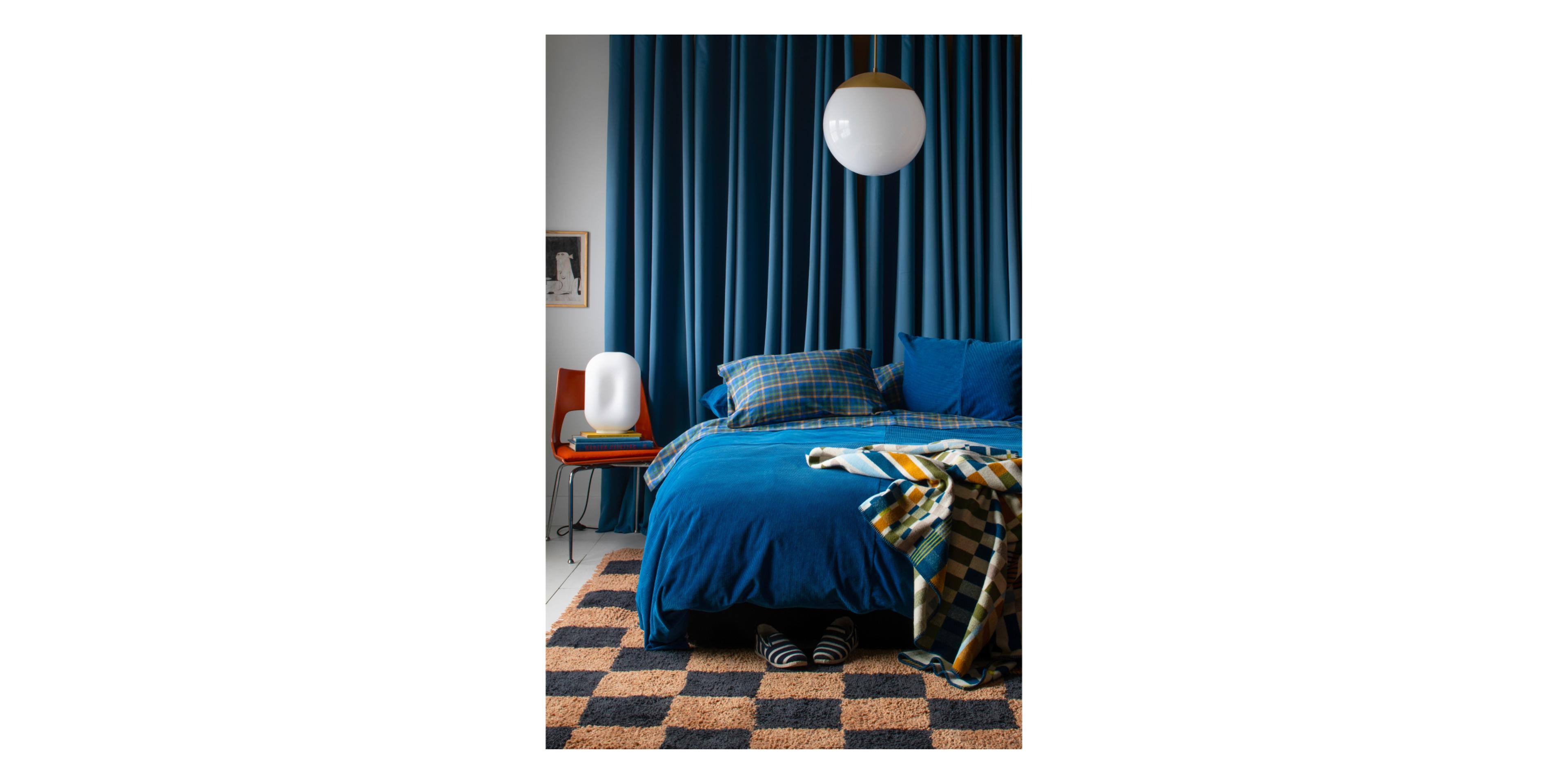 bedroom setting with cobalt corduroy bedding