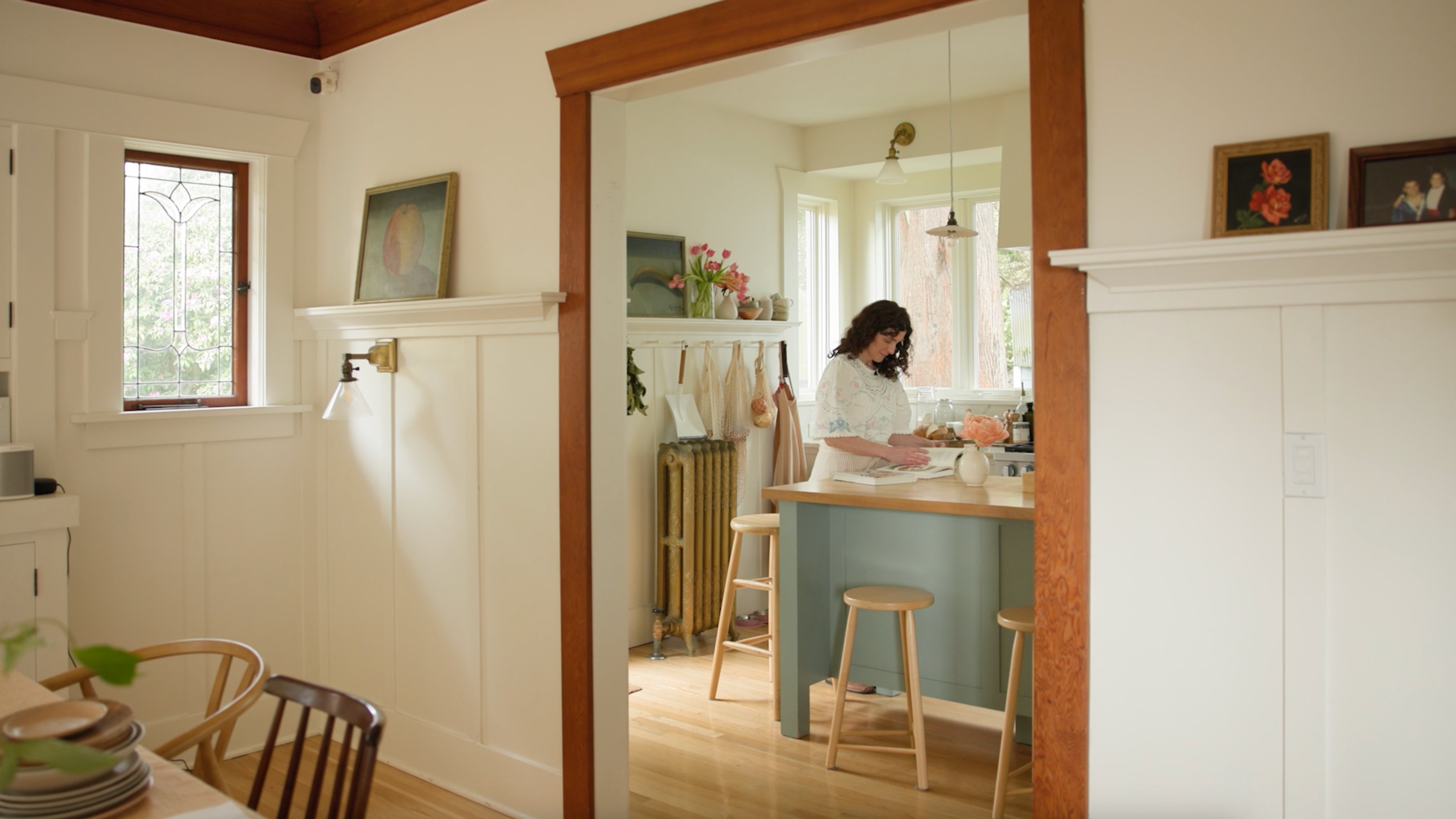 Woman in her sunny kitchen. 