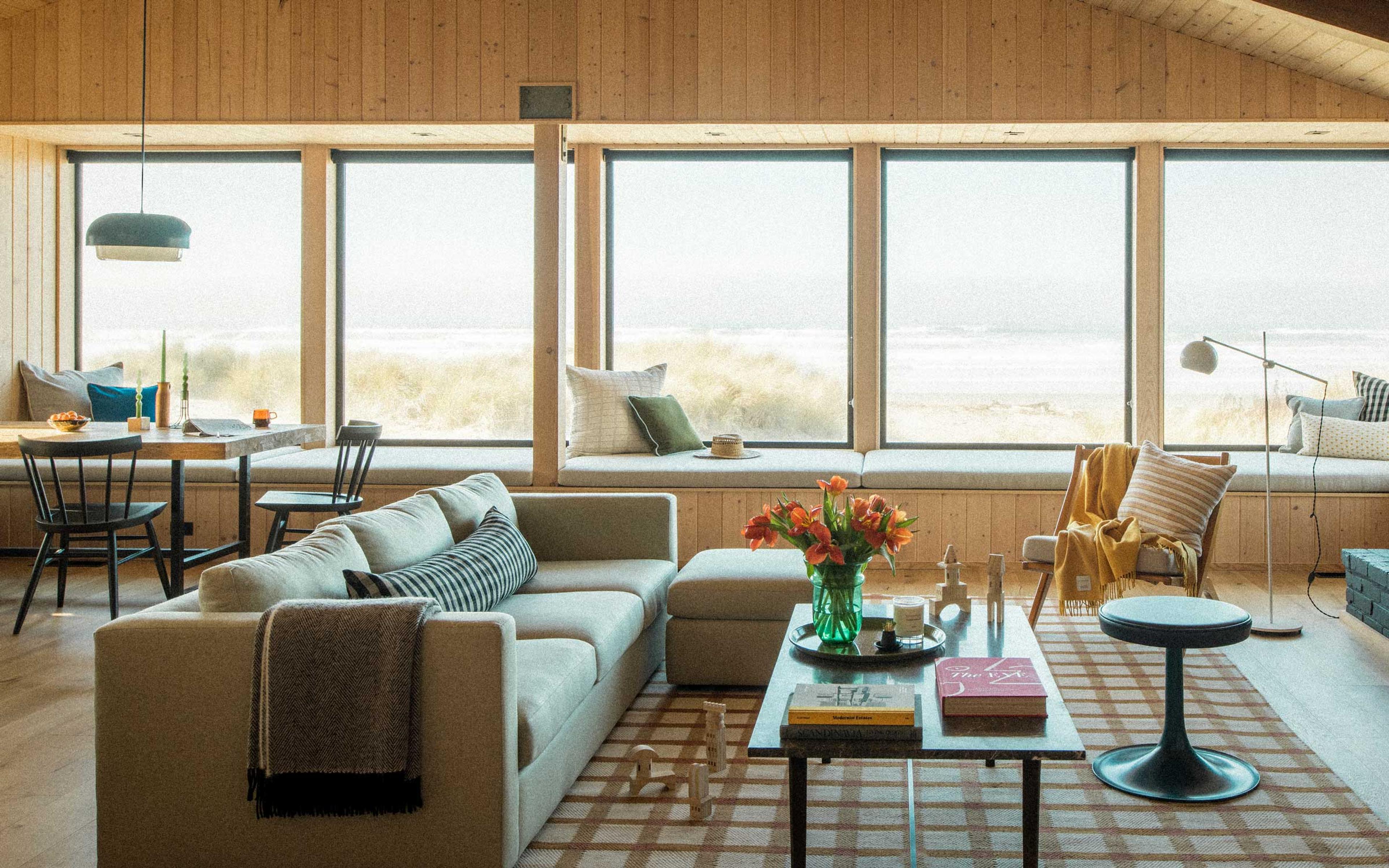 The living room of a modern mid century beach house. 