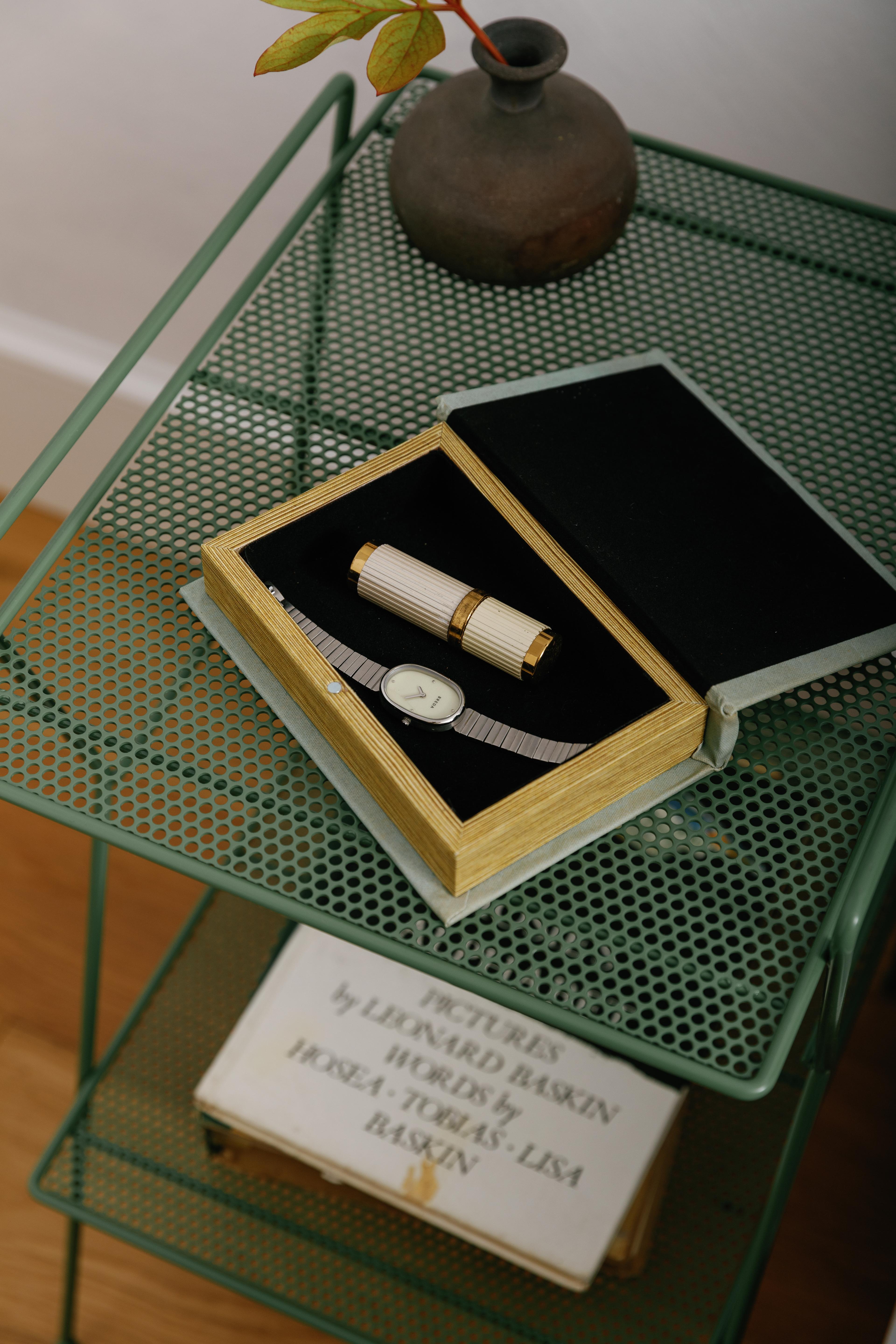 Telephone table next to bed.