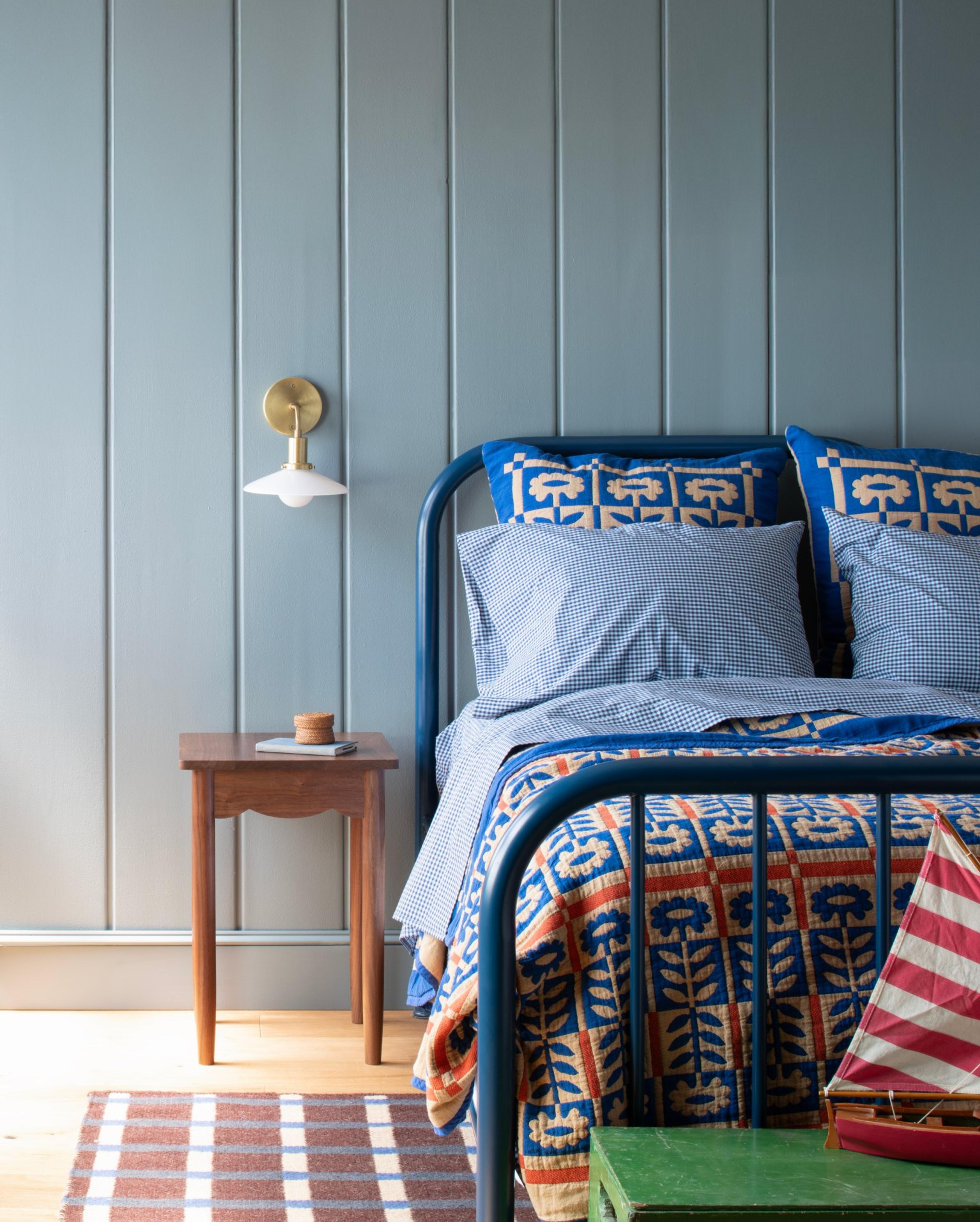Bed with cobalt Stillwater quilt