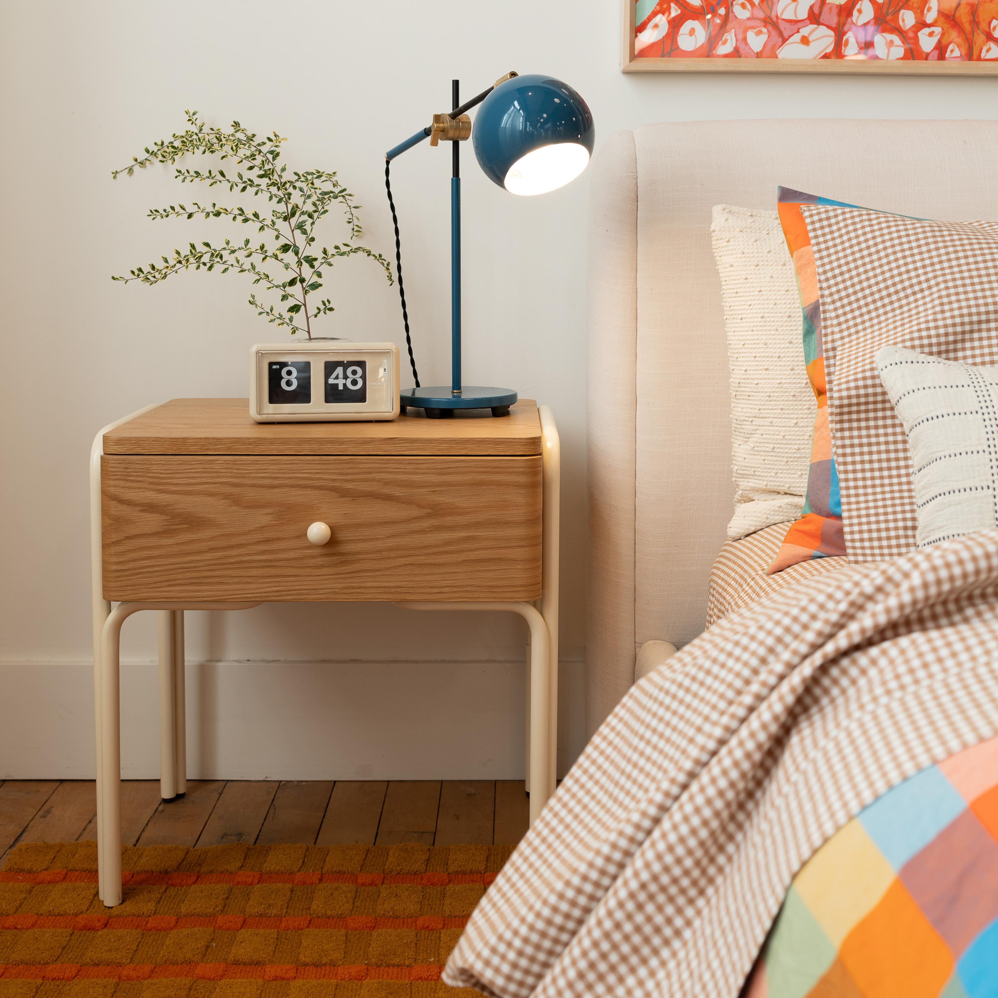 Lamp on nightstand. 